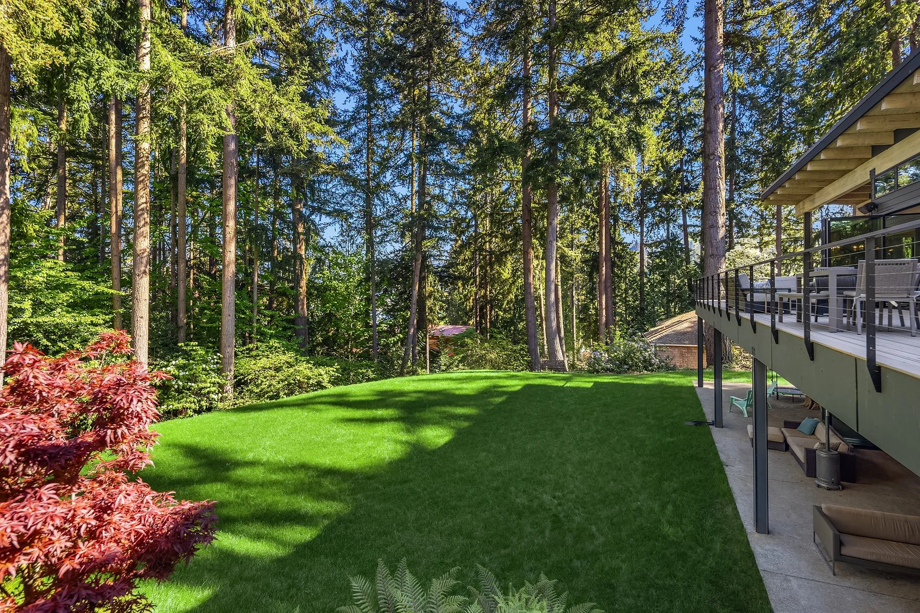 view from the garage down to the large lawn