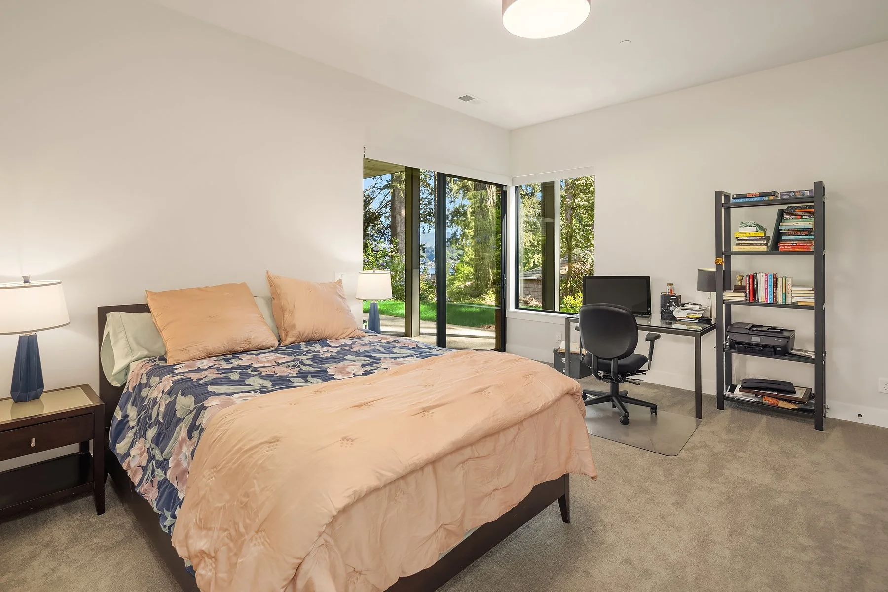 lower level bedroom with access to the back patio