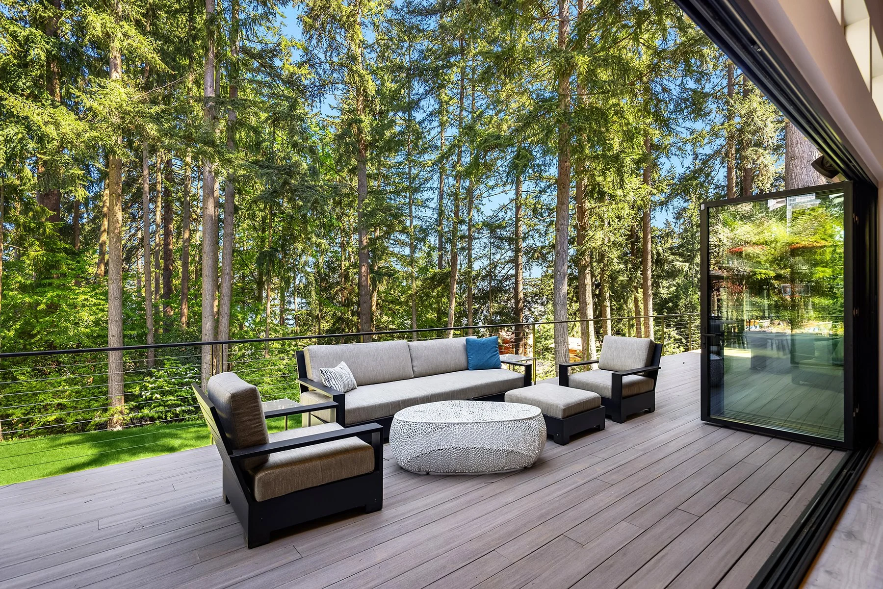 Nestled in the trees on an oversized lot with partial views of Lake Samammish