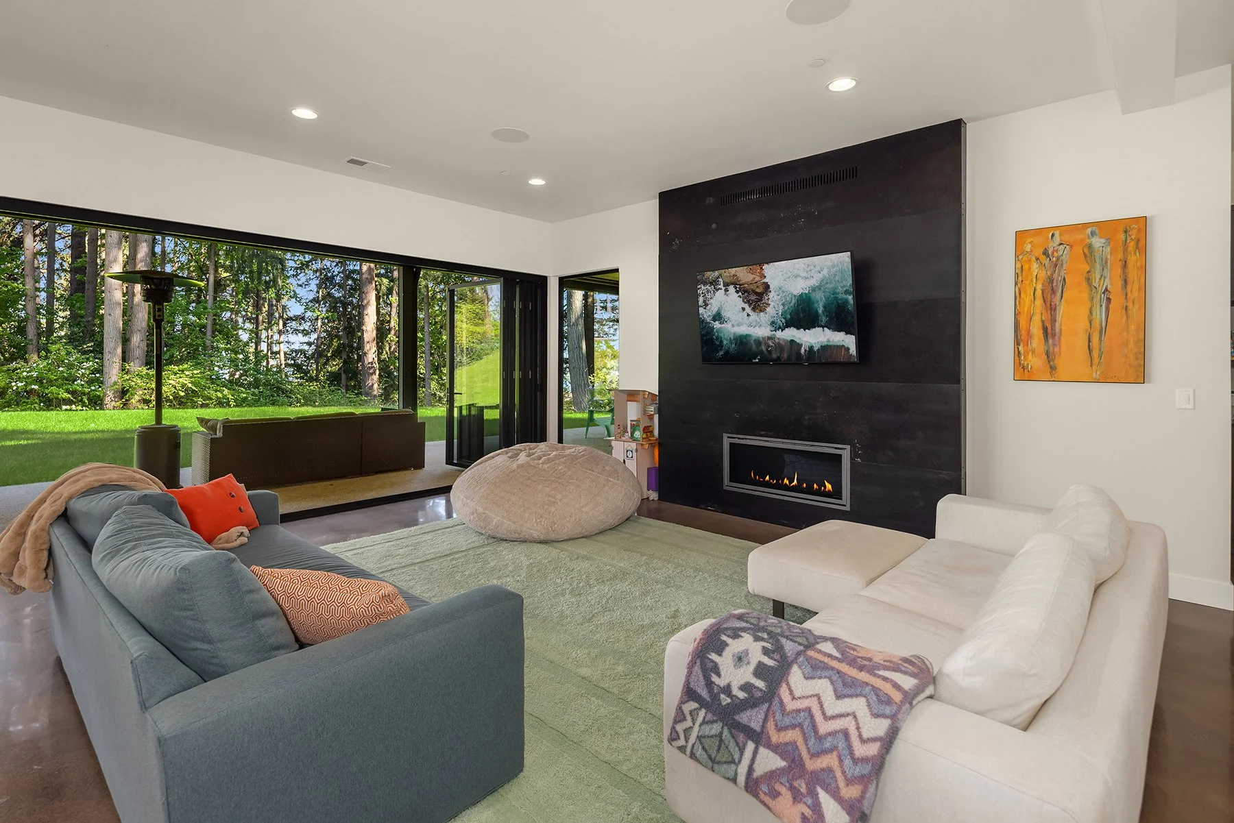 The lower level also offers indoor/outdoor living - flowing out to the huge lawnspace
