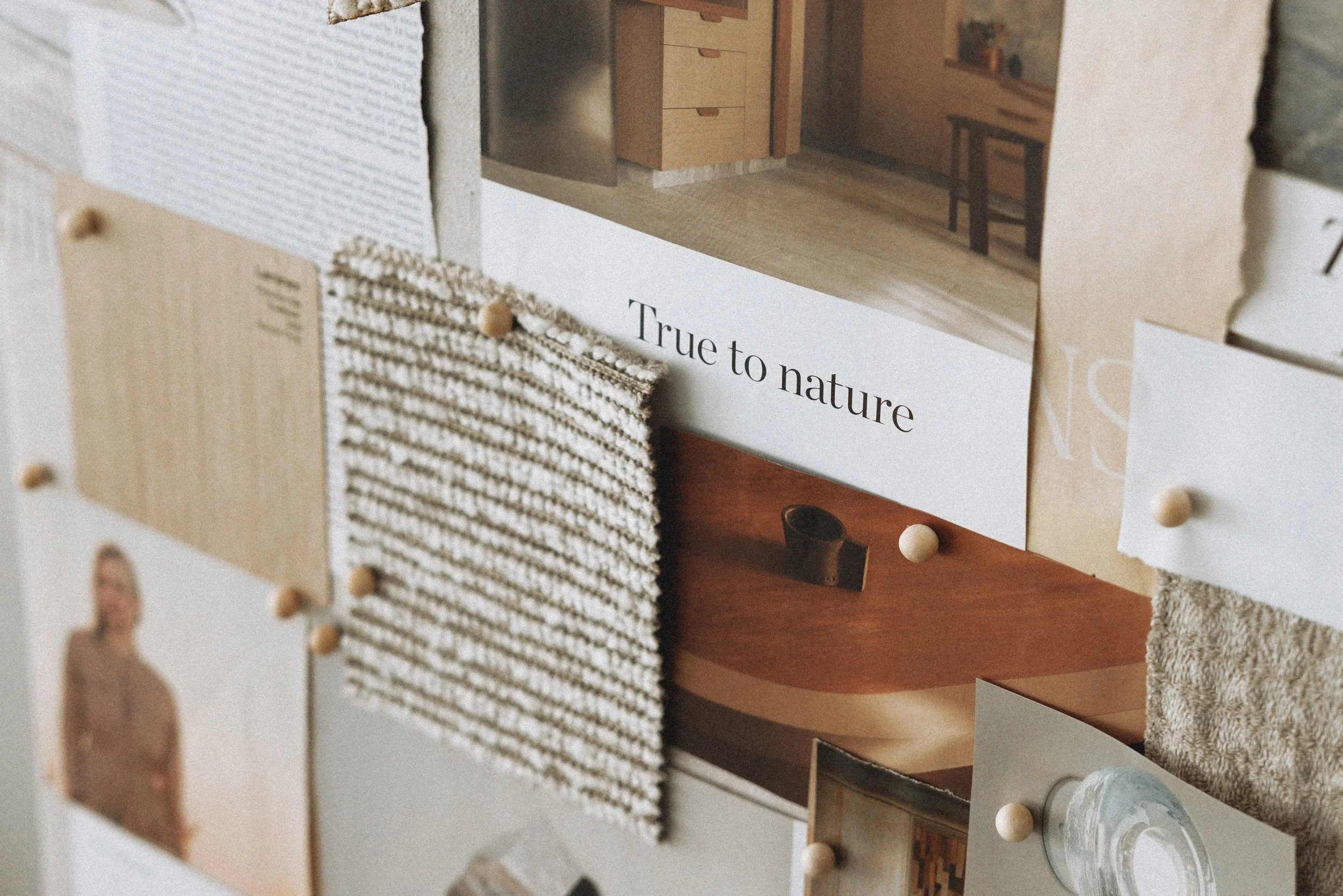 Close-up of an interior architectural model featuring small-scale furniture and textured rugs, with a focus on natural and neutral color tones.