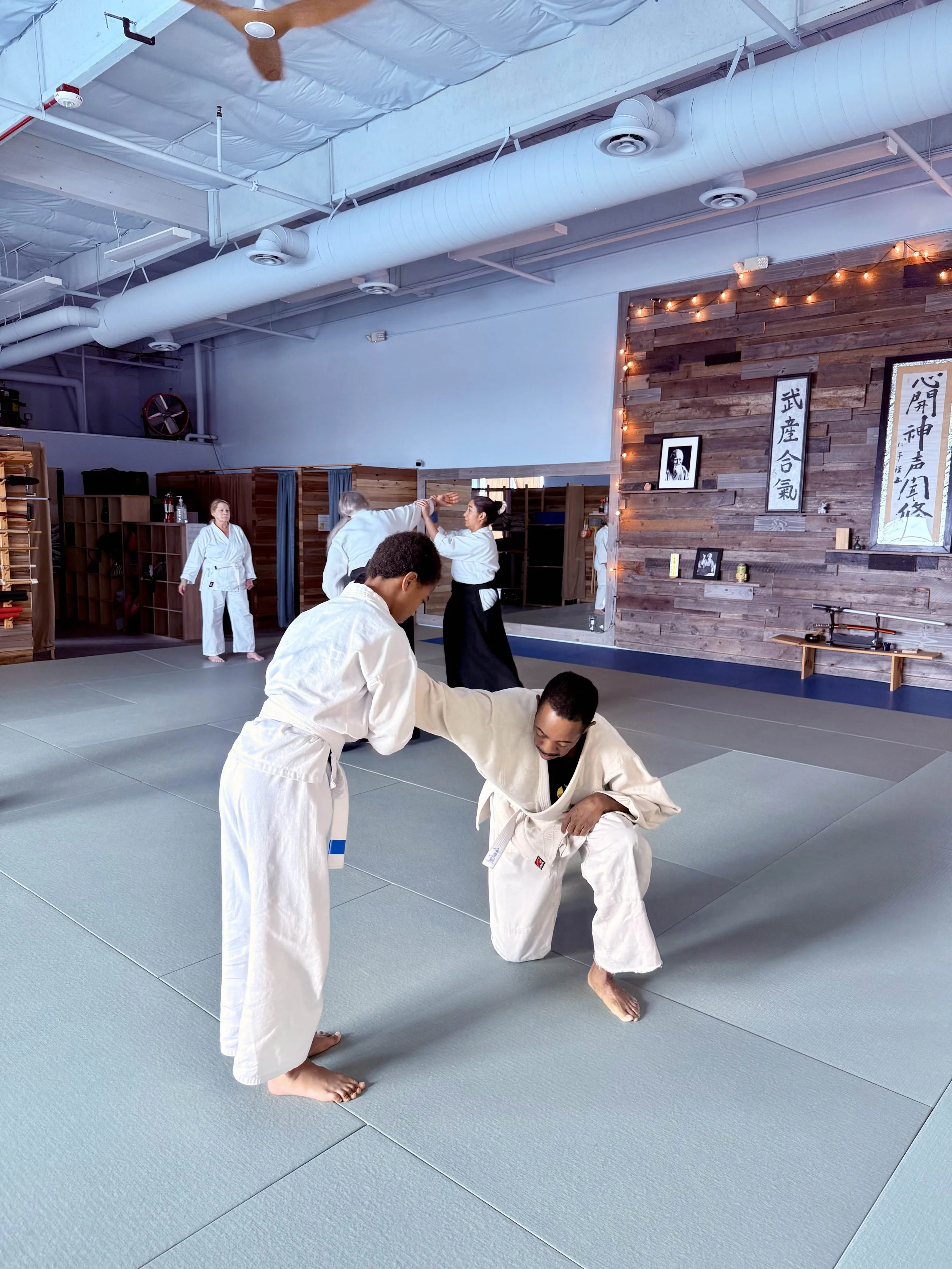 Two students practicing Aikido at Henderson Aikido & Yoga.