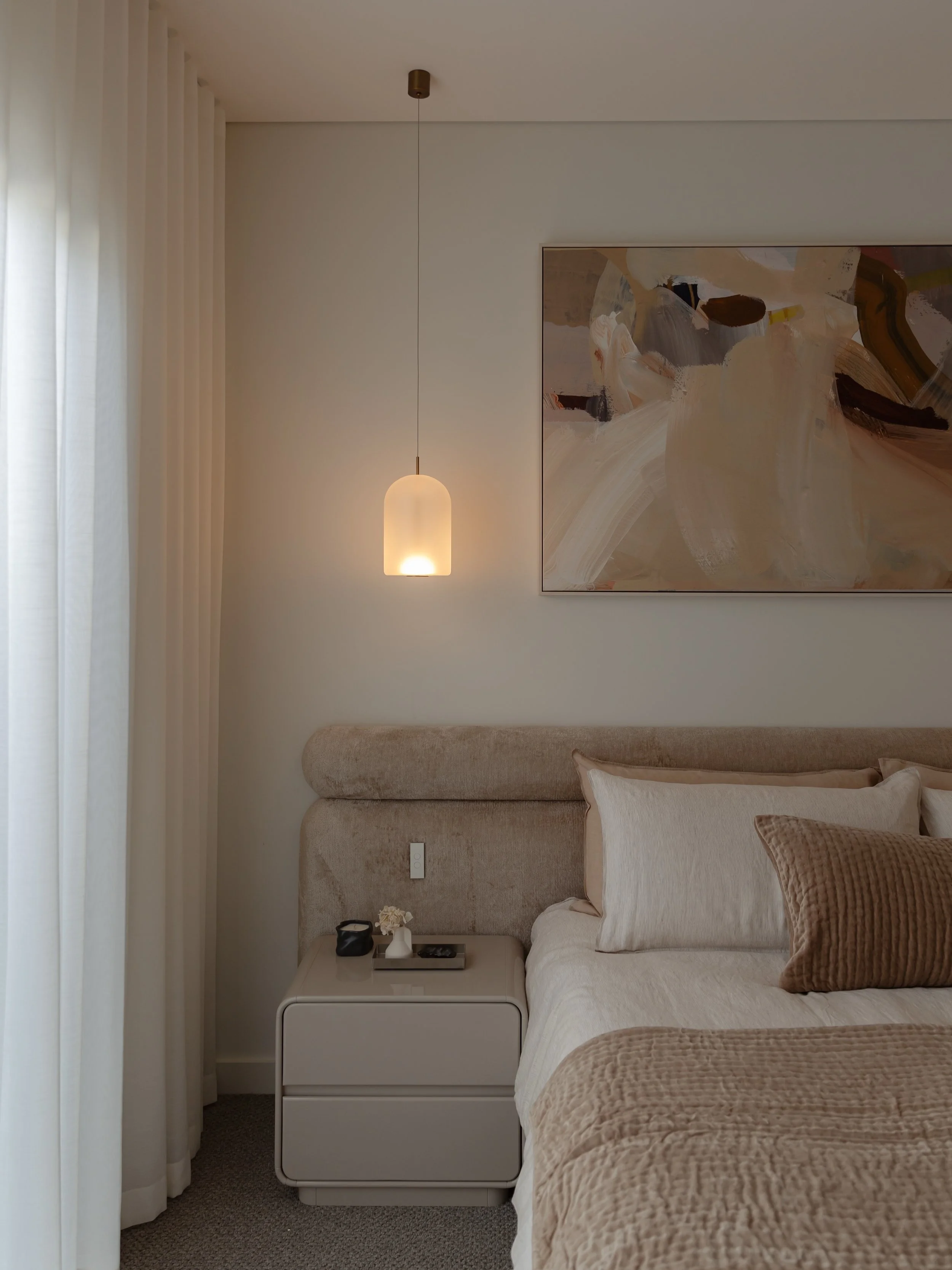 A beautiful room is one thing. 
A room that works beautifully is another.

For this primary bedroom, Kellie knew early on that a custom bed frame would be the best way to bring the space together and meet the brief our client was after. 

The bedhead