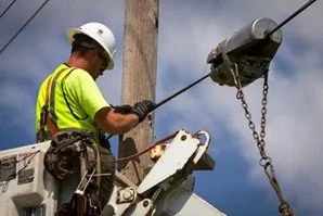 Fiber over-lash technician working on broadband infrastructure