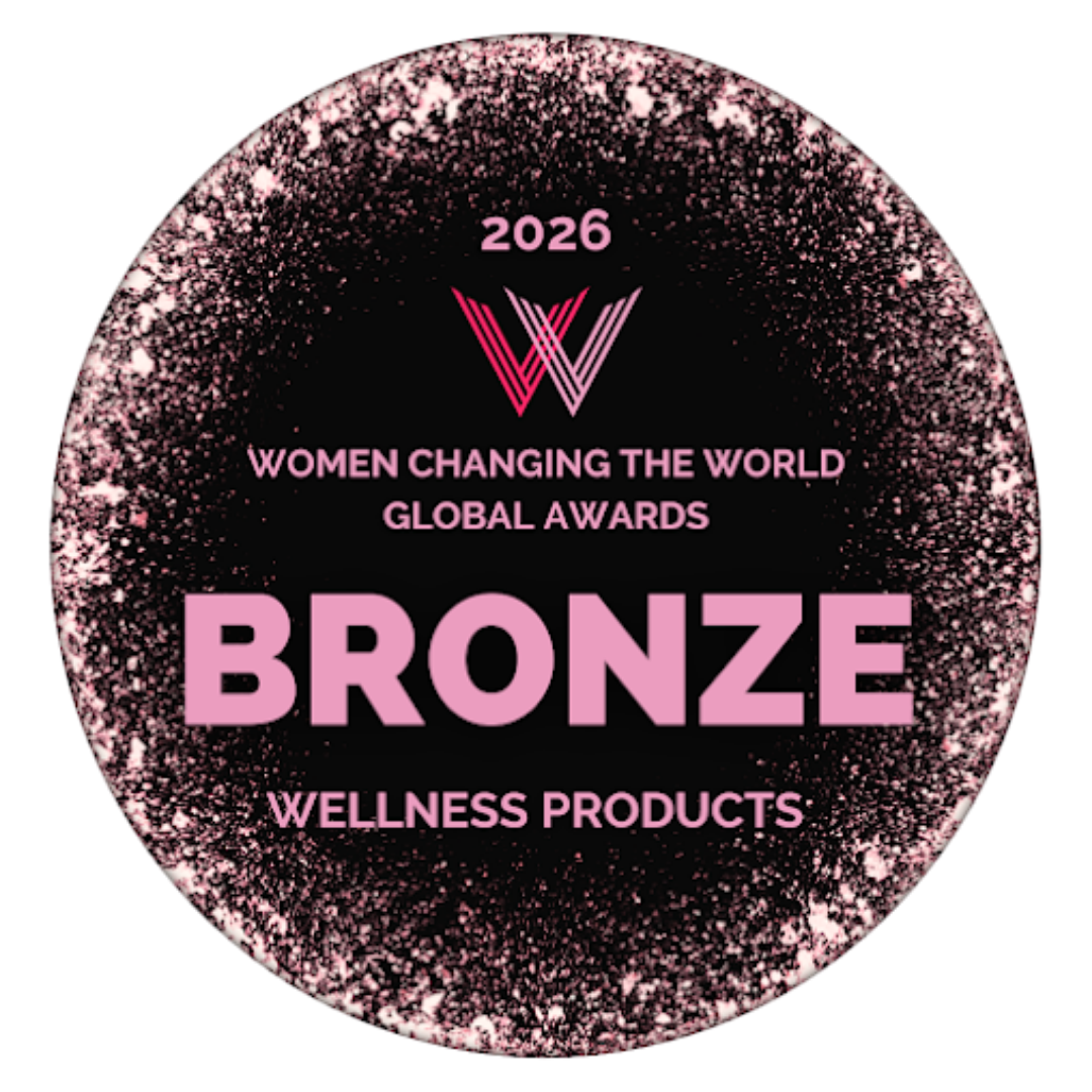 Bronze award badge for Women Changing the World Global Awards 2026 for wellness products, with pink and black design and glitter accents.