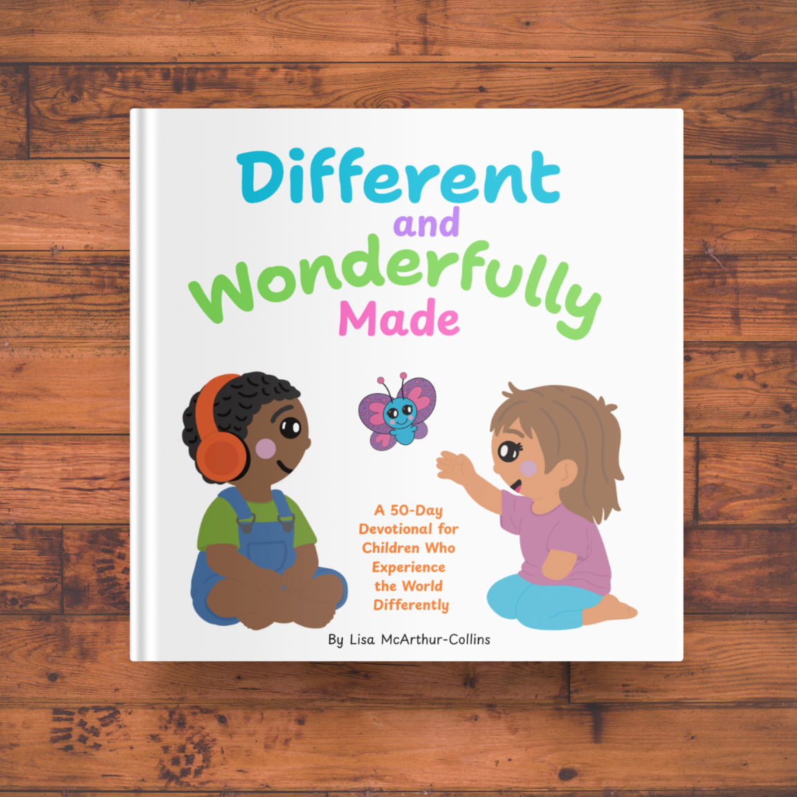 Book cover titled "Different and Wonderfully Made" featuring two young girls and a butterfly, with a wooden background.