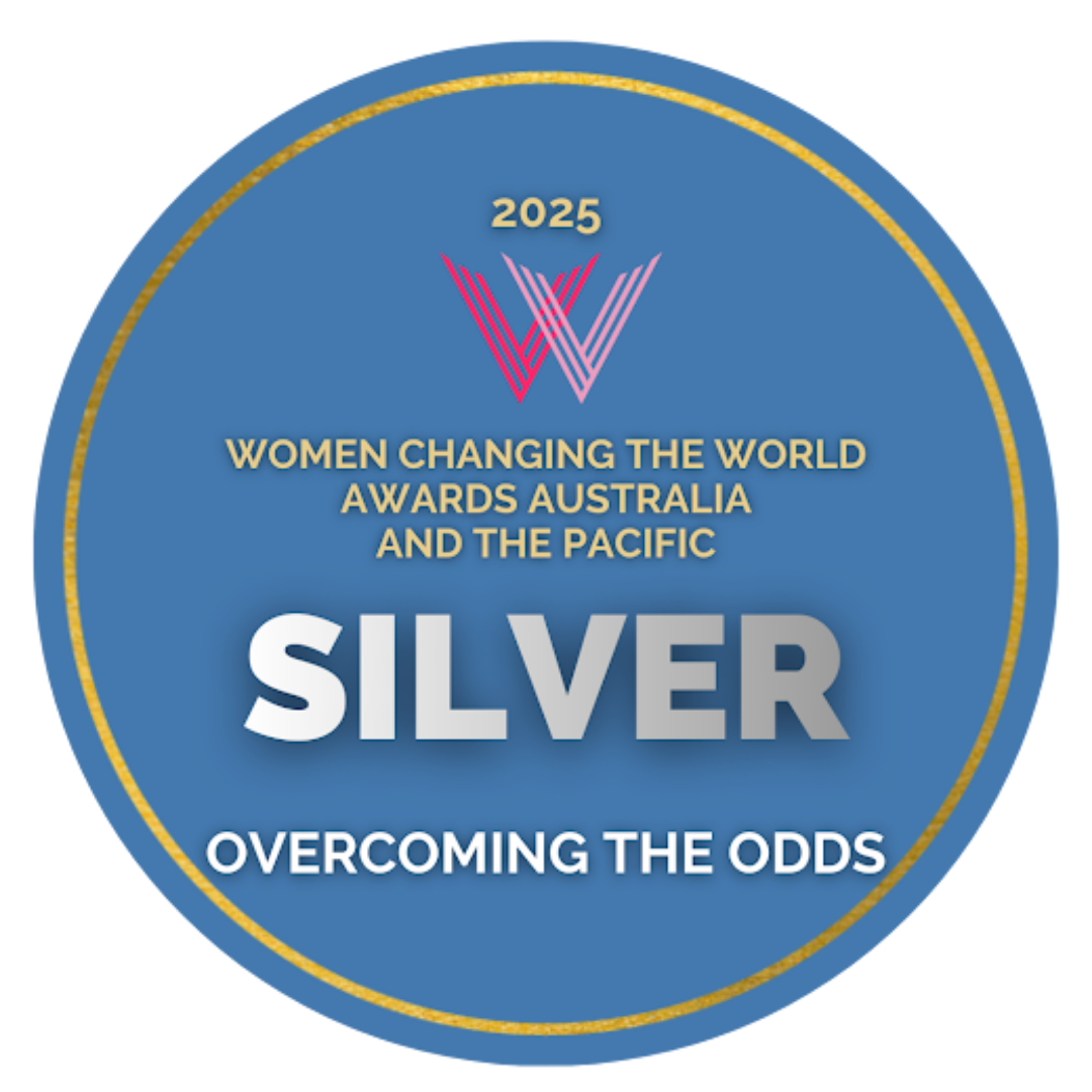 Blue circular award badge for the 2025 Women Changing the World Awards Australia and the Pacific, indicating a silver recognition for overcoming the odds.