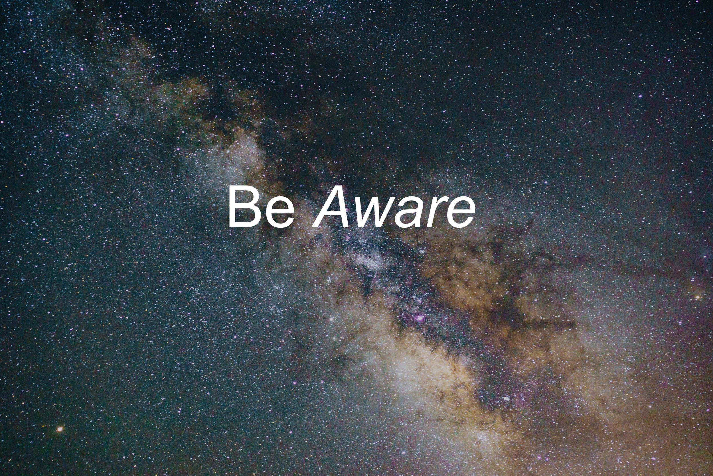 Starry night sky with the words "Be Aware" in white text.