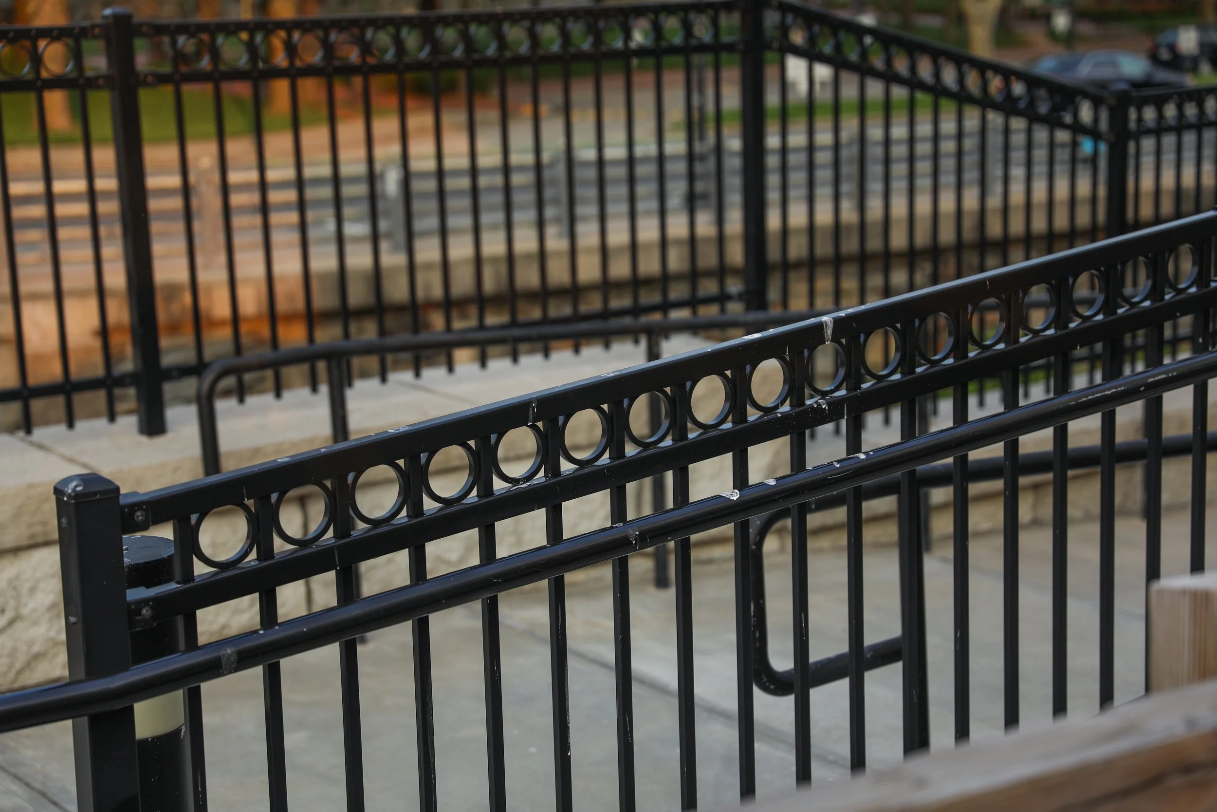 black-iron-fence-with-decorative-design-center.jpg