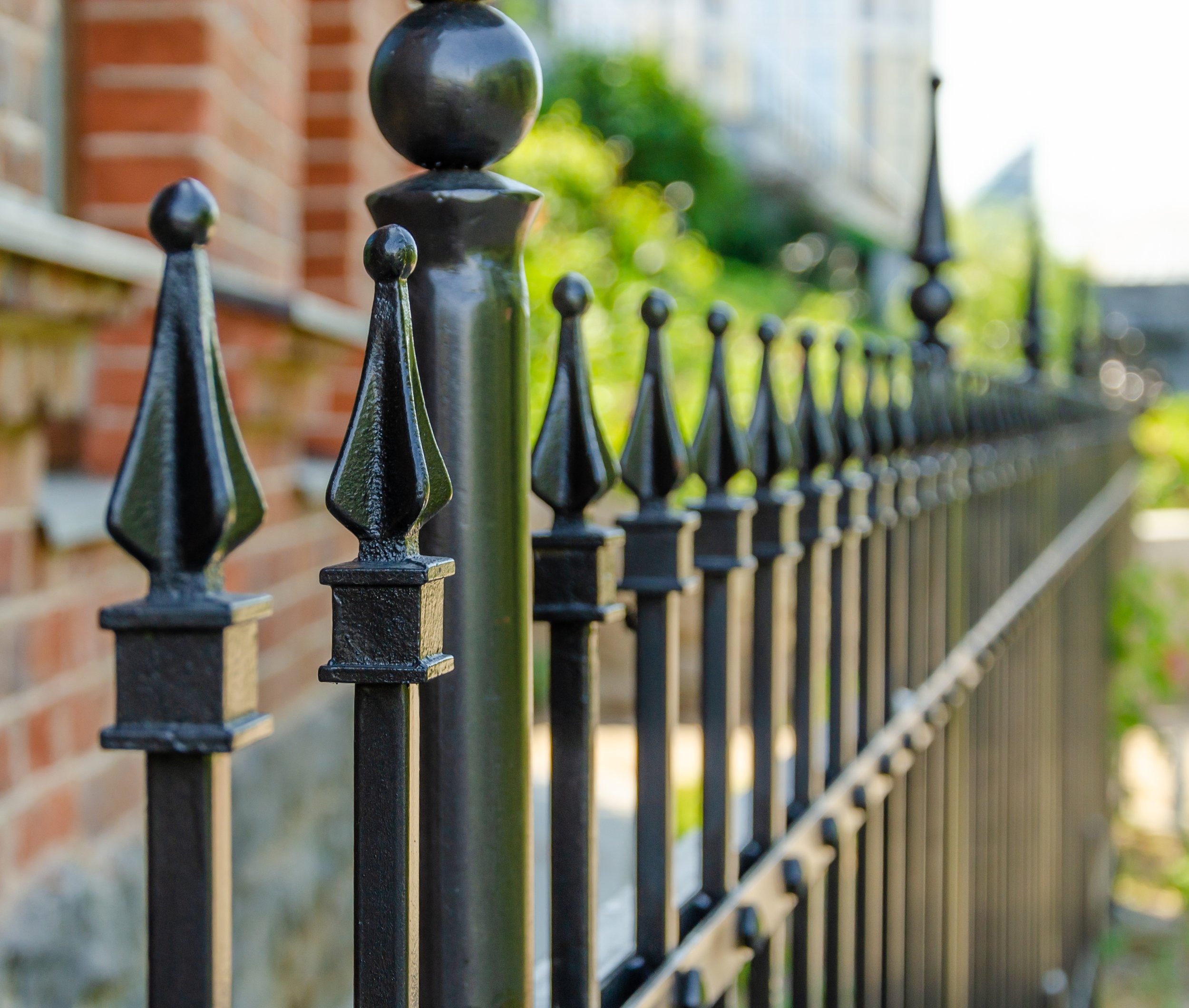 long-iron-fence-with-sharp-peaks.jpg