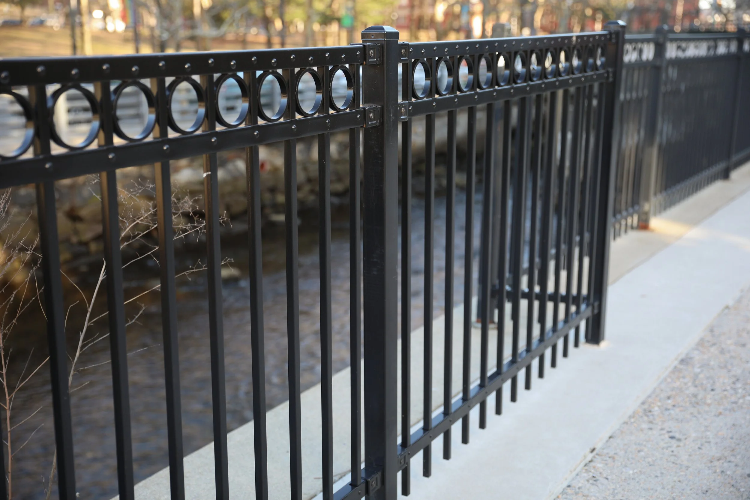 black-iron-fence-with-circular-design-top.jpg