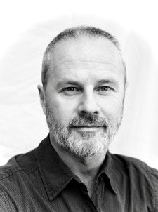 A black-and-white portrait of a David Digapony.