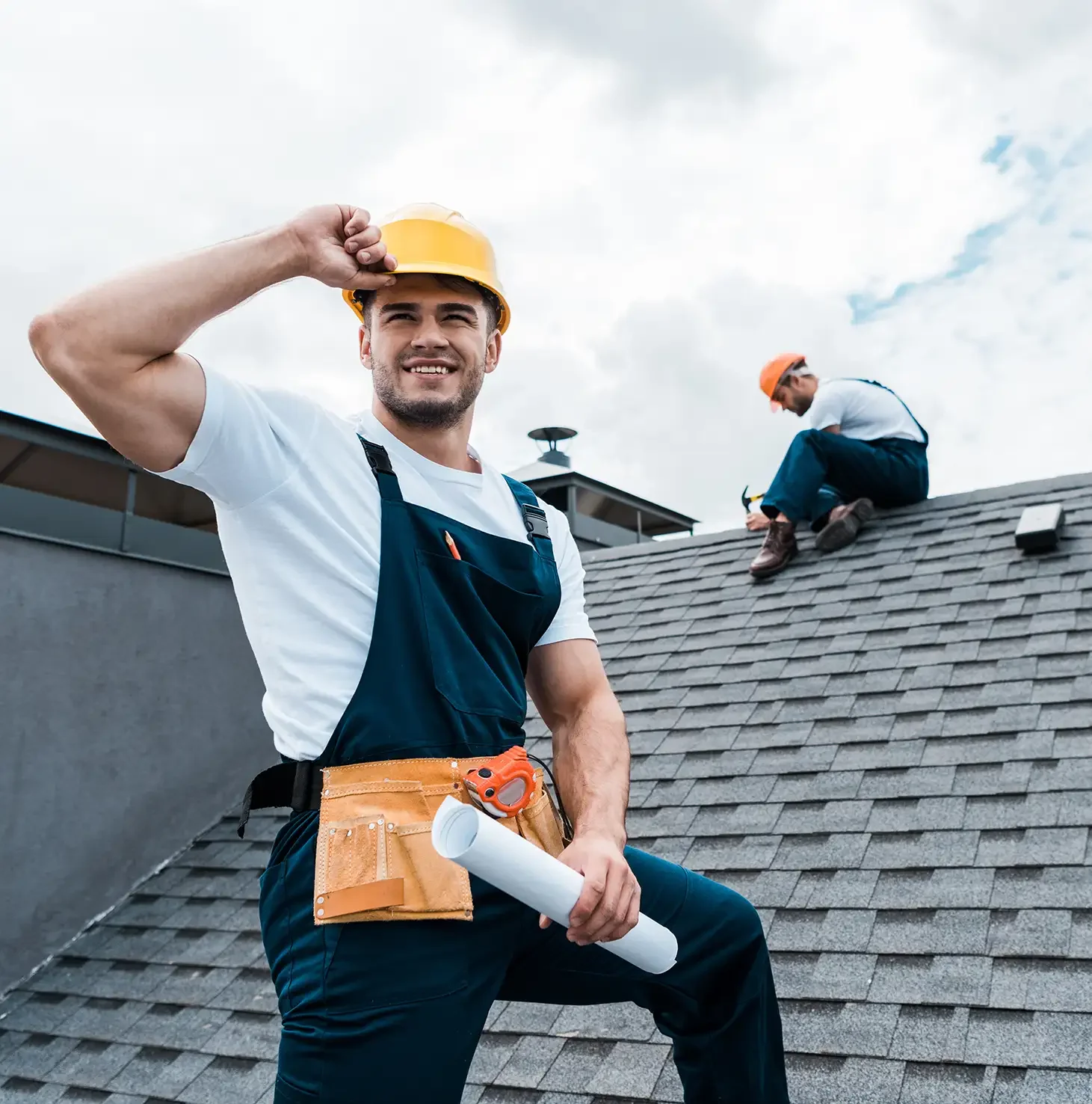 Expert roofers providing a free roofing repair estimate for a home on the Utah Wasatch Front.