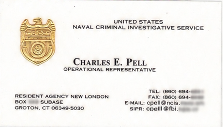 Charles's former NCIS business card, with contact info redacted, from his prior Navy service.