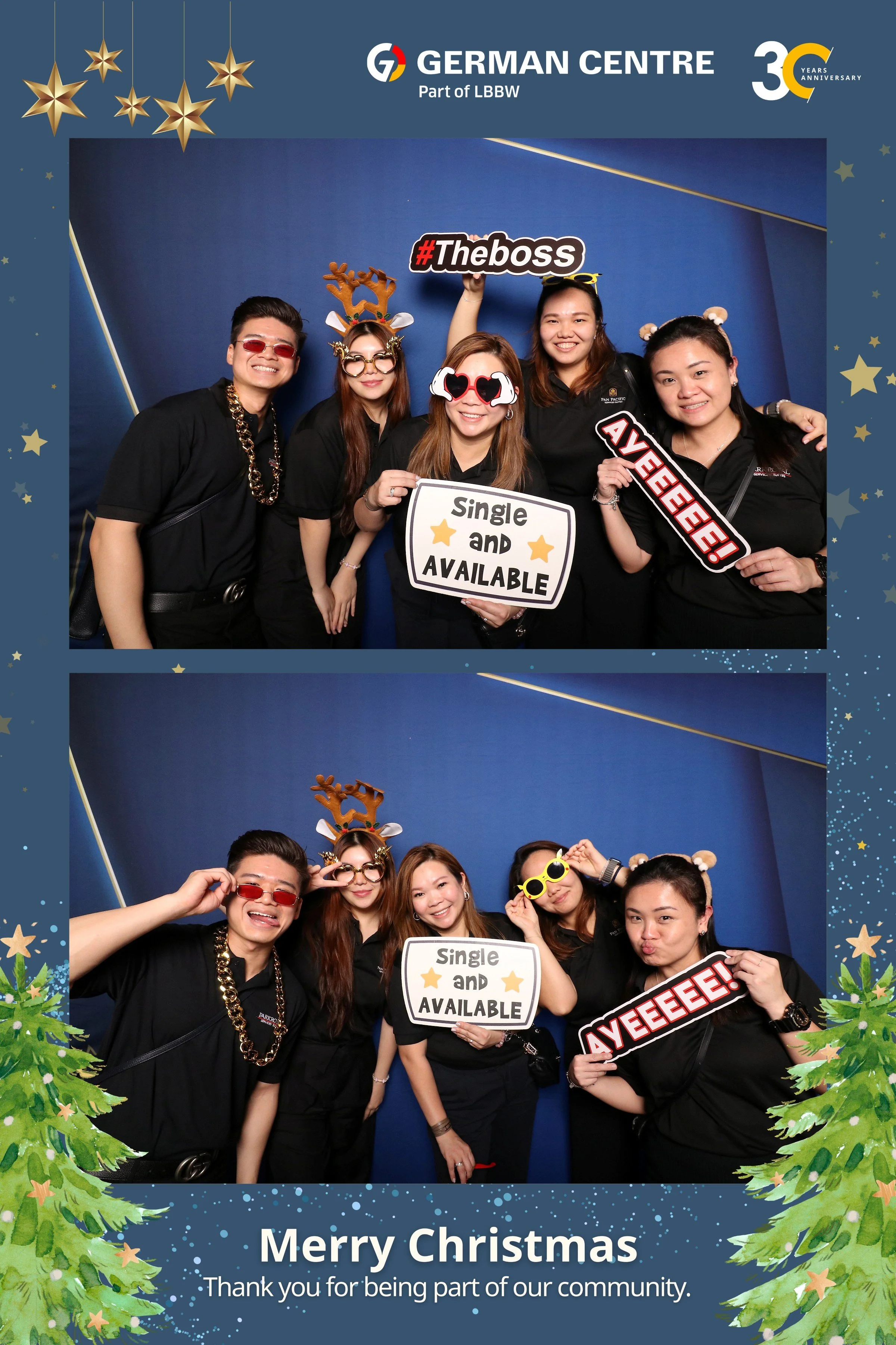 A group of six people celebrating Christmas wearing festive accessories, holding signs, and smiling for a photo. The background is blue with Christmas-themed decorations, and the frame is decorated with green pine branches and golden stars. The text on the frame reads "Merry Christmas" and "Thank you for being part of our community."