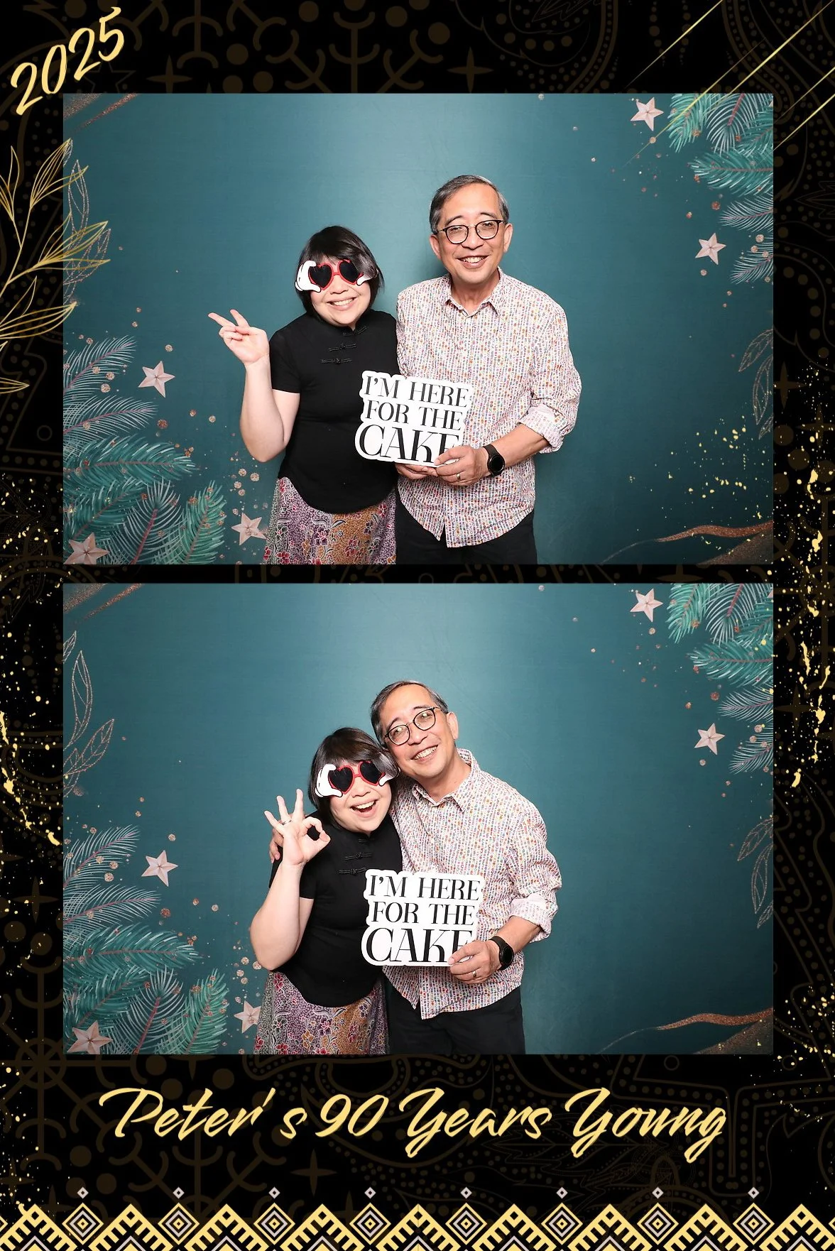Two people smiling at a photo booth with a teal background decorated with palm leaves, stars, and gold accents. The woman is wearing heart-shaped sunglasses and holding a sign that says "I'M HERE FOR THE CAKE." The man is wearing glasses, a patterned shirt, and is holding the same sign. The event celebrates Peter turning 90 years old in 2023.