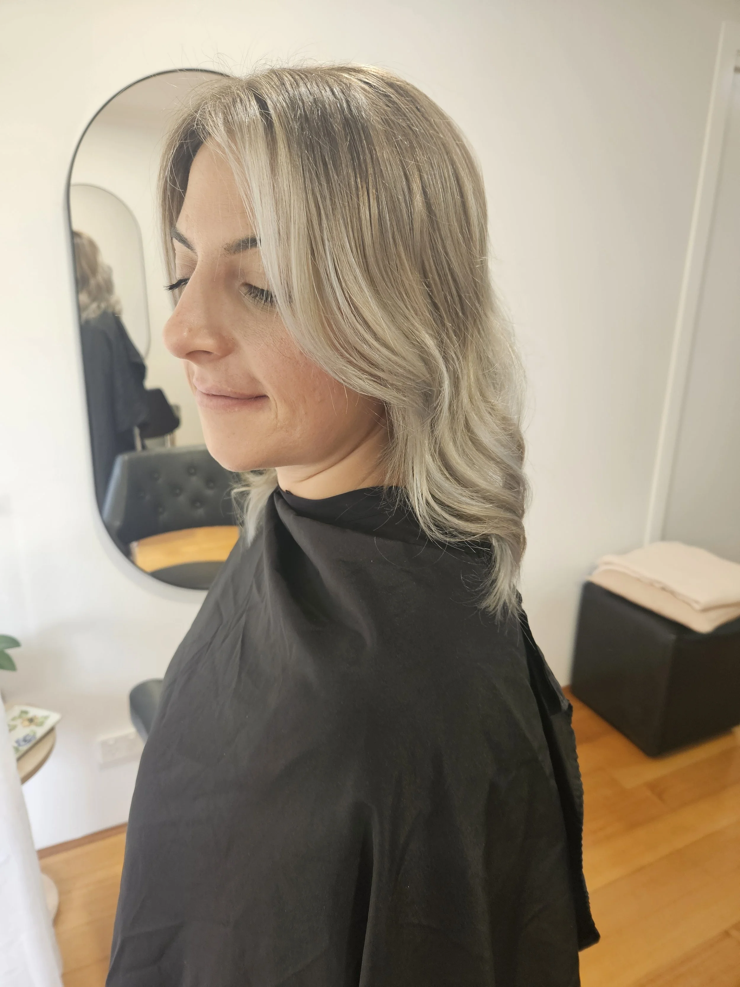 Blonde balayage and soft waves created at Jazz Up Your Hair in Eagle Vale Sydney.