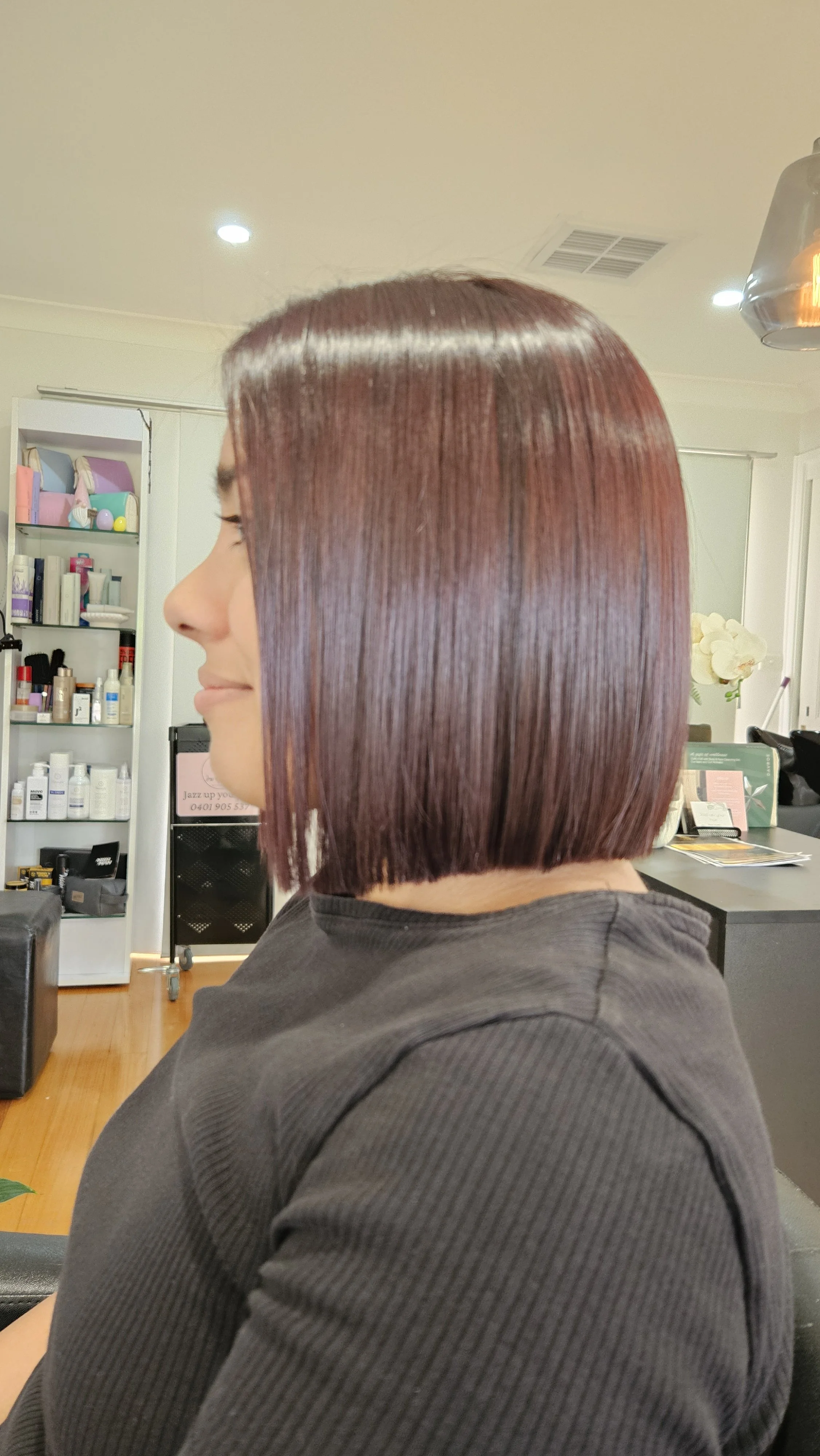 Sleek red bob haircut and colour by Jazz Up Your Hair in Eagle Vale Sydney.