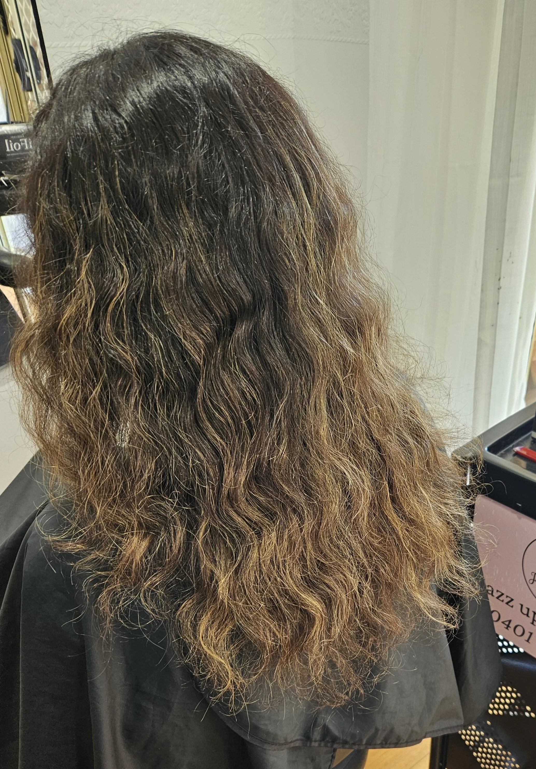Before photo of curly frizzy hair prior to smoothing treatment at Jazz Up Your Hair in Eagle Vale Sydney.