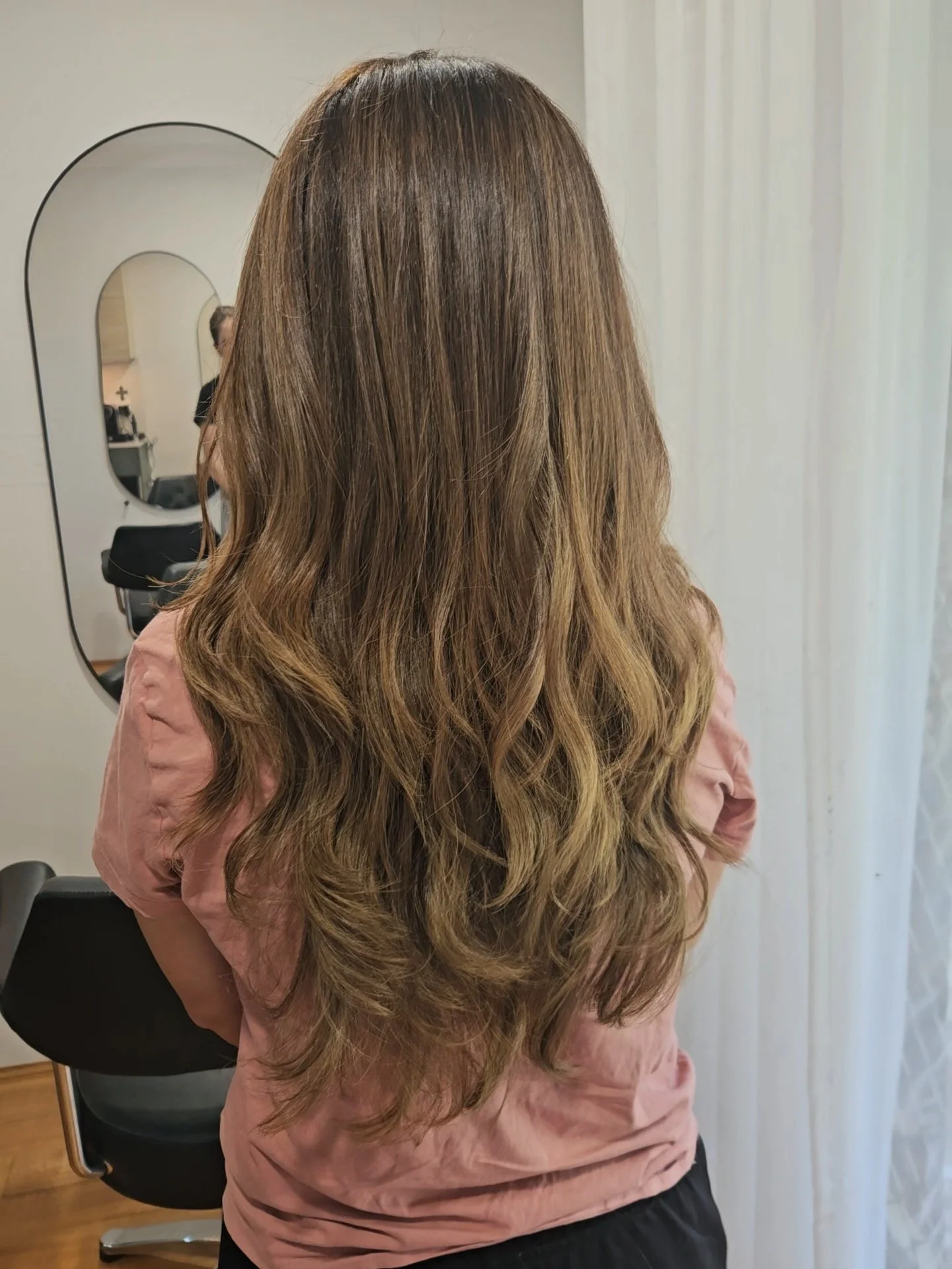 Brunette balayage with soft waves created at Jazz Up Your Hair in Eagle Vale Sydney.