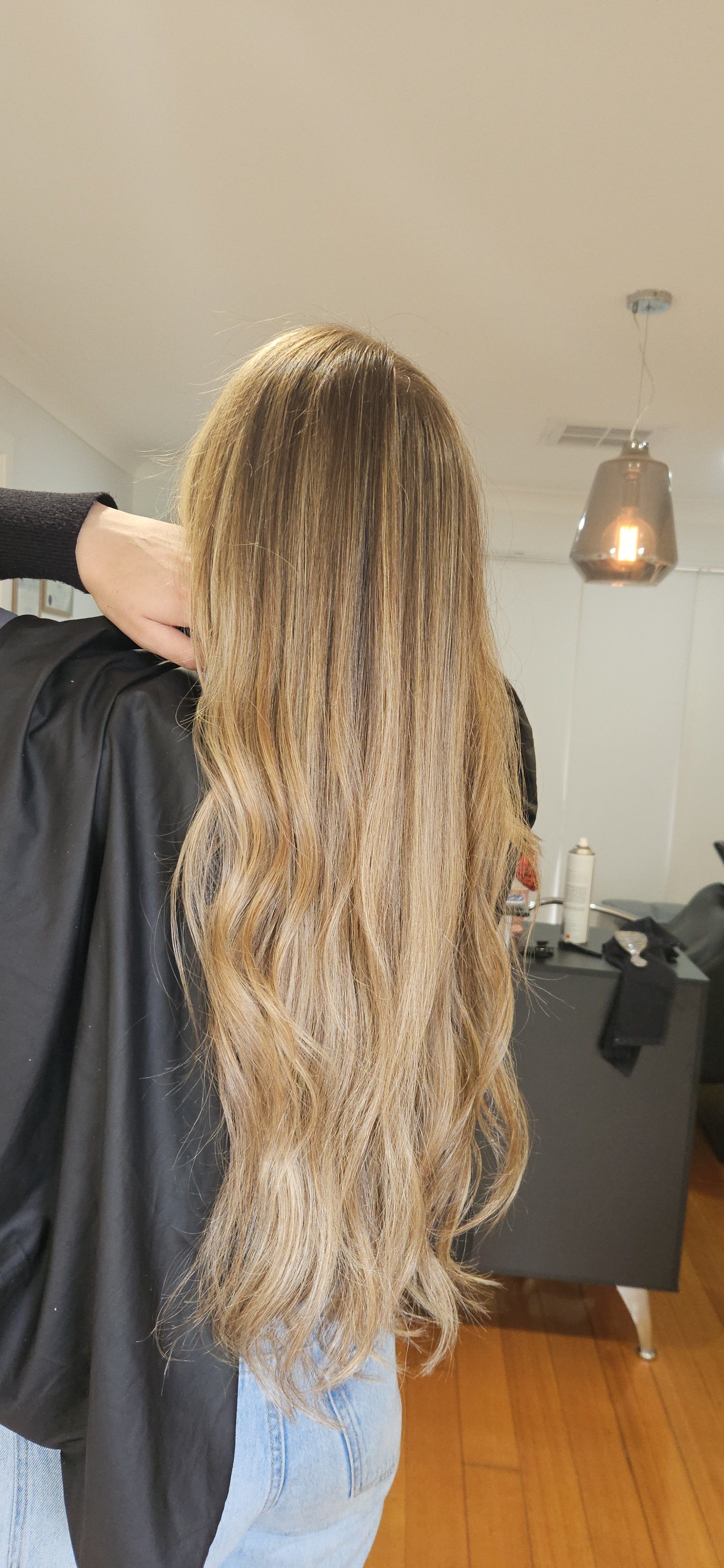 Long blonde hair extensions and styling at Jazz Up Your Hair in Eagle Vale Sydney.