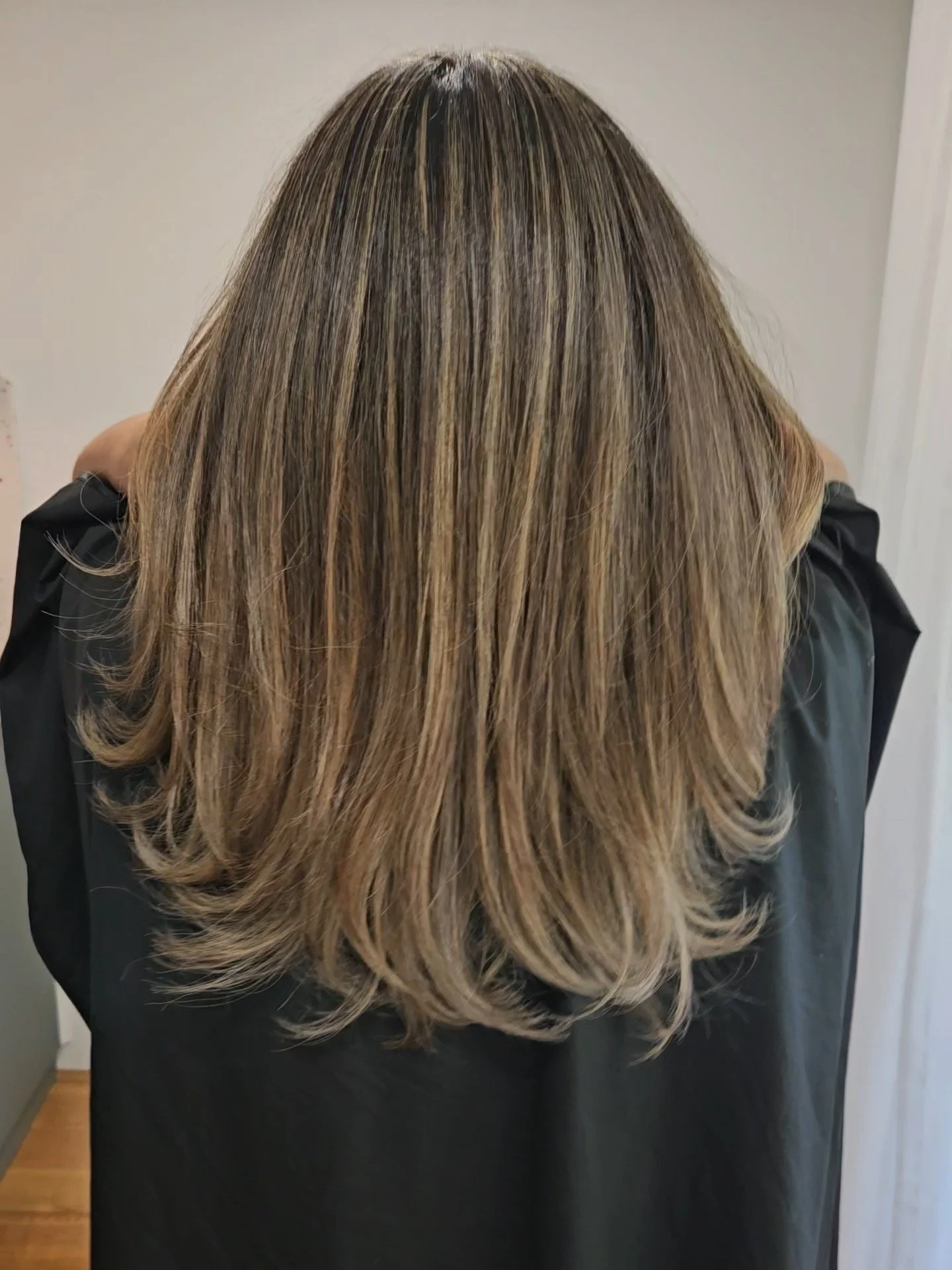 After photo of smooth highlighted hair following treatment at Jazz Up Your Hair in Eagle Vale Sydney.