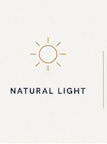 A graphic of a sun icon with the words 'Natural Light' below it.