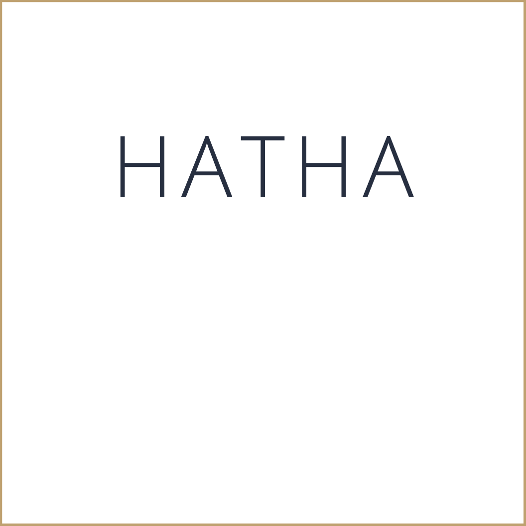 A white rectangular card with the word 'HATHA' written in large, dark blue, uppercase letters in the center.