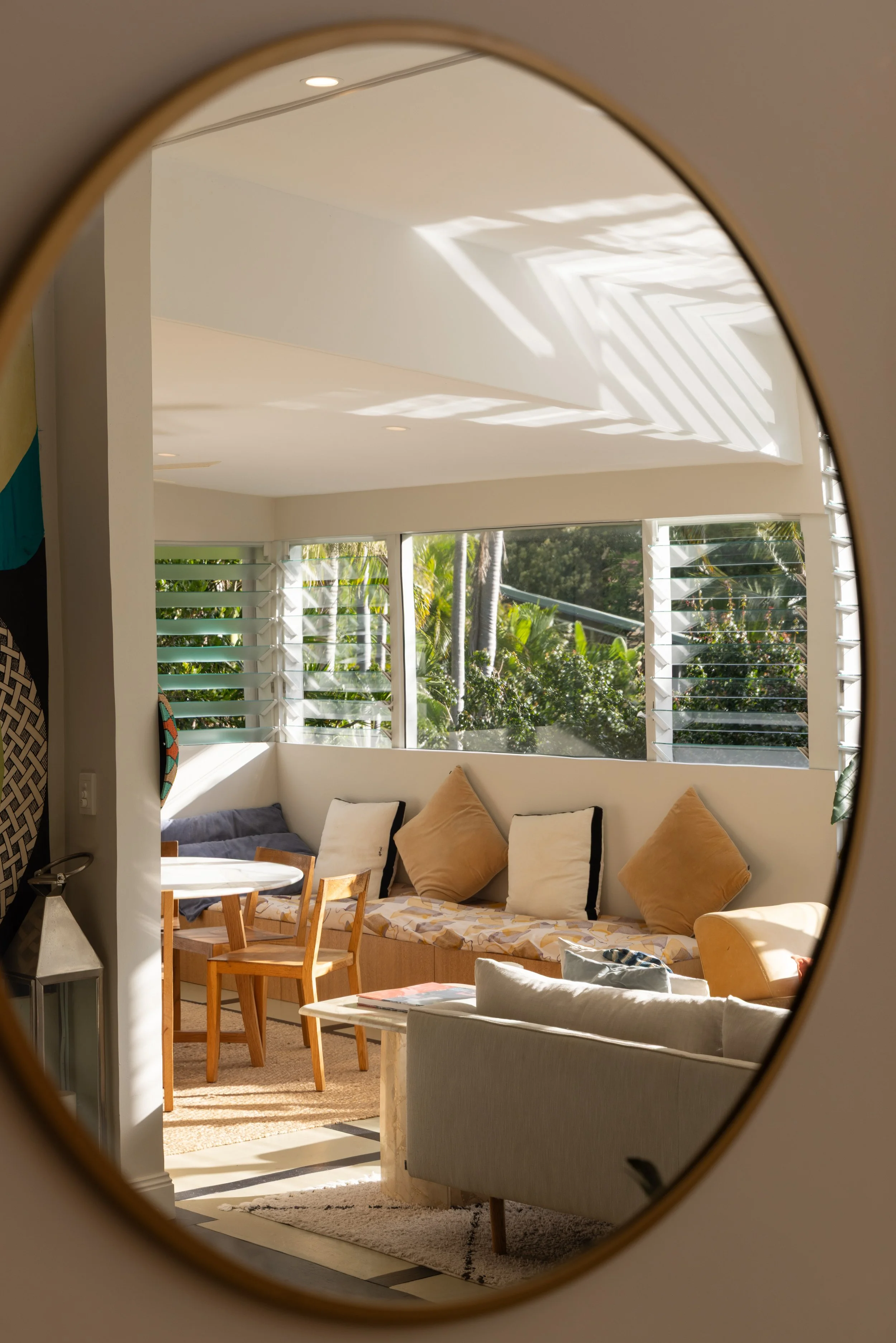 Curated Airbnb living space with elevated coastal styling details