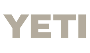 Close-up of the YETI logo in gray on a black background.