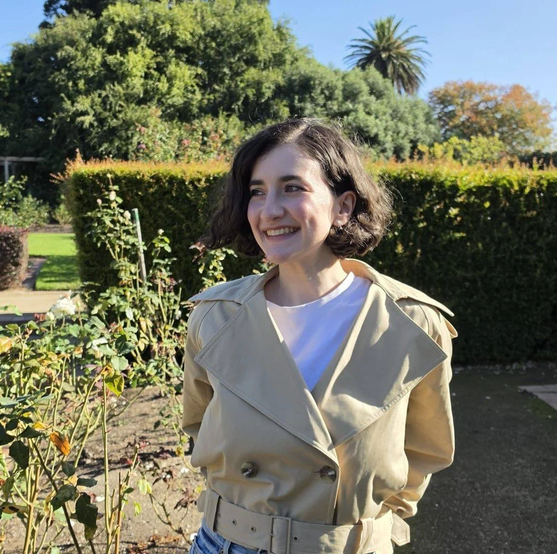 Author Dr Isabelle Schupak outdoors in a garden setting