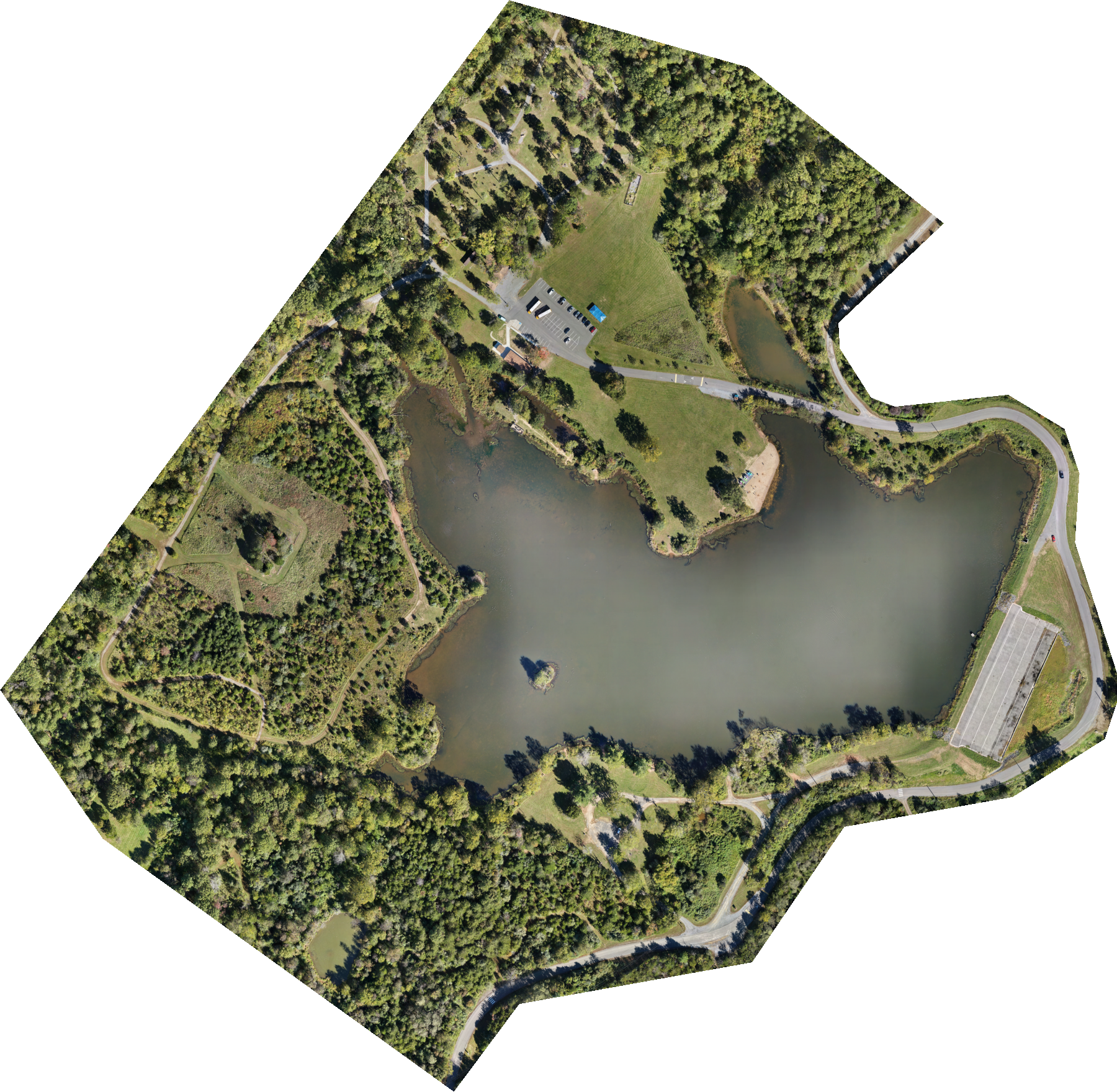 Drone orthomosaic of Silver Lake Regional Park showing the lake, shoreline, paths, woodland, roads, and parking areas, clipped to the usable imagery boundary.