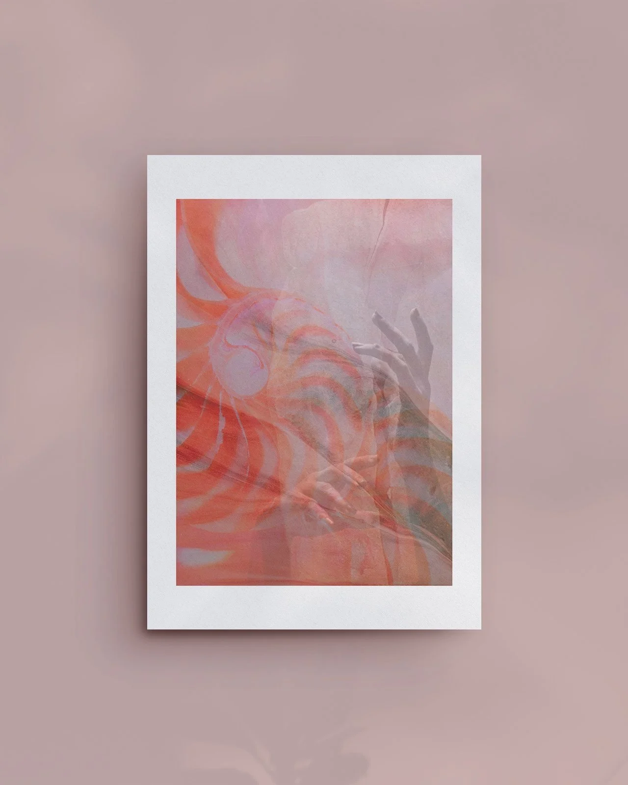 A framed abstract artwork with swirling pink, orange, and white patterns, reflecting a faint image of a hand with fingers spread out.