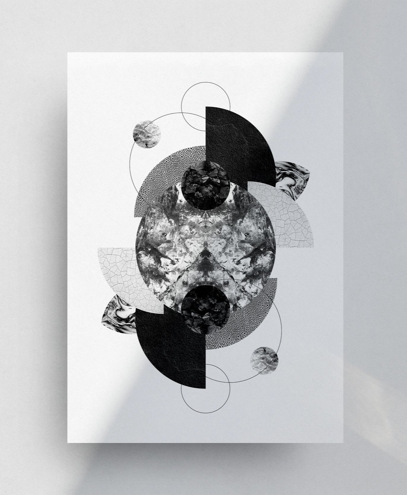 Black and white abstract geometric collage with circles, semi-circles, and textured patterns on white background.