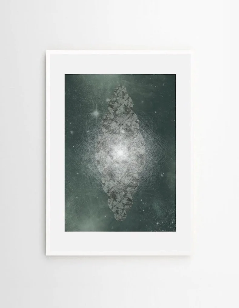 Abstract art of a galaxy or nebula with a mirrored, symmetrical design in a white picture frame on a gray wall.