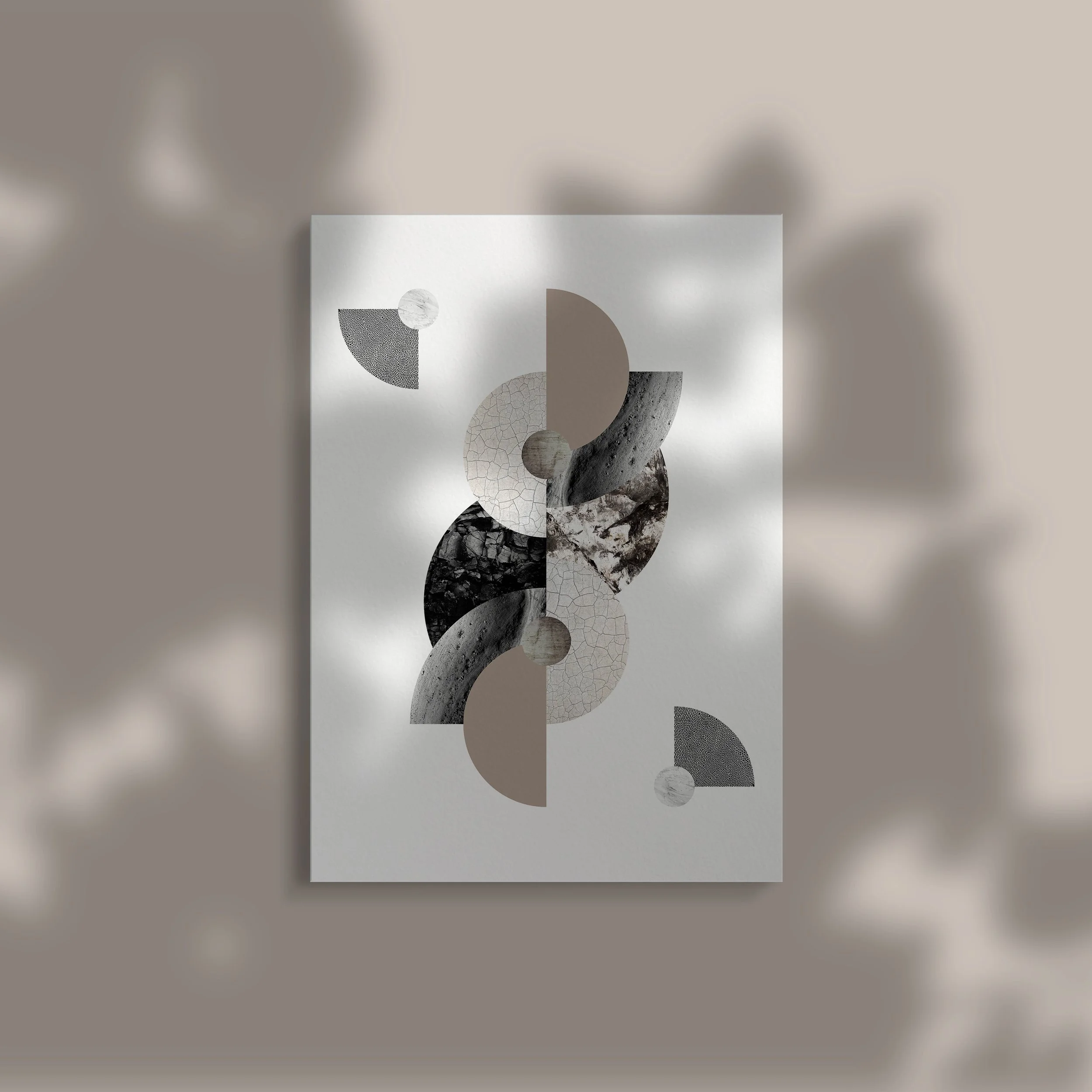 Abstract artwork featuring geometric shapes in shades of beige, gray, black, and white, arranged in a symmetrical pattern on a white background.