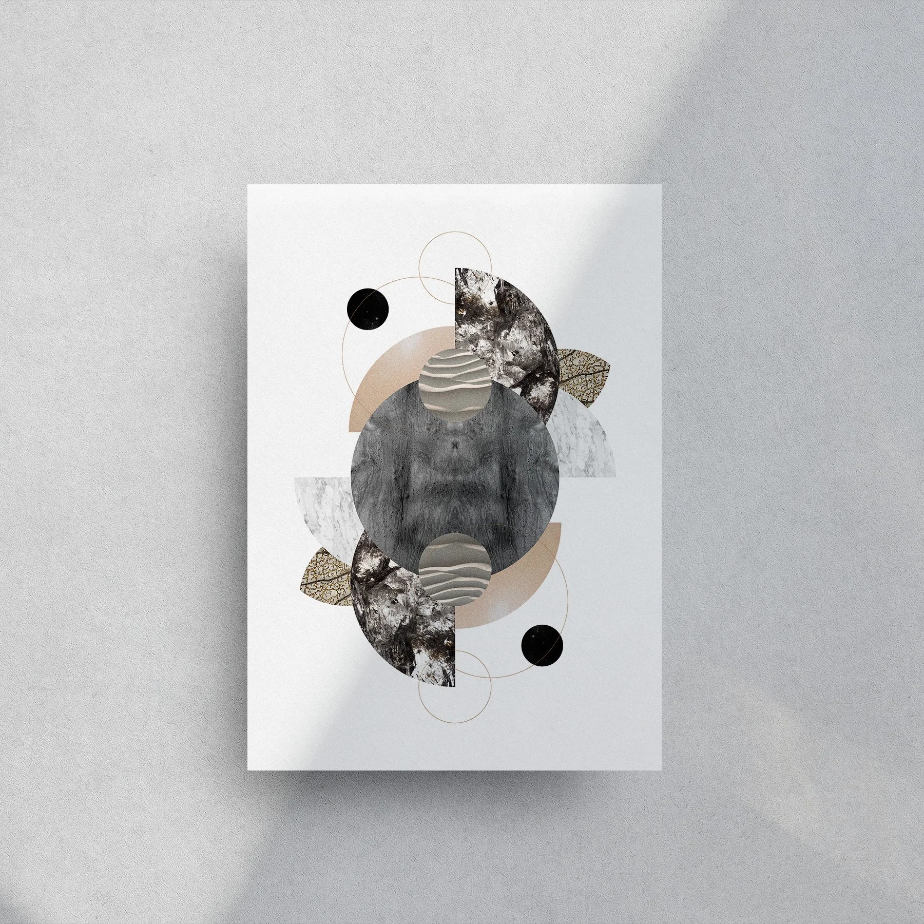 Abstract geometric art print on white paper featuring circles, semi-circles, and textured shapes in black, gray, beige, and brown tones, with thin gold circles, displayed on a light gray surface.