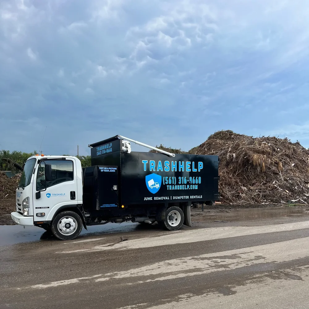 TrashHelp truck hauling a load of yard debris