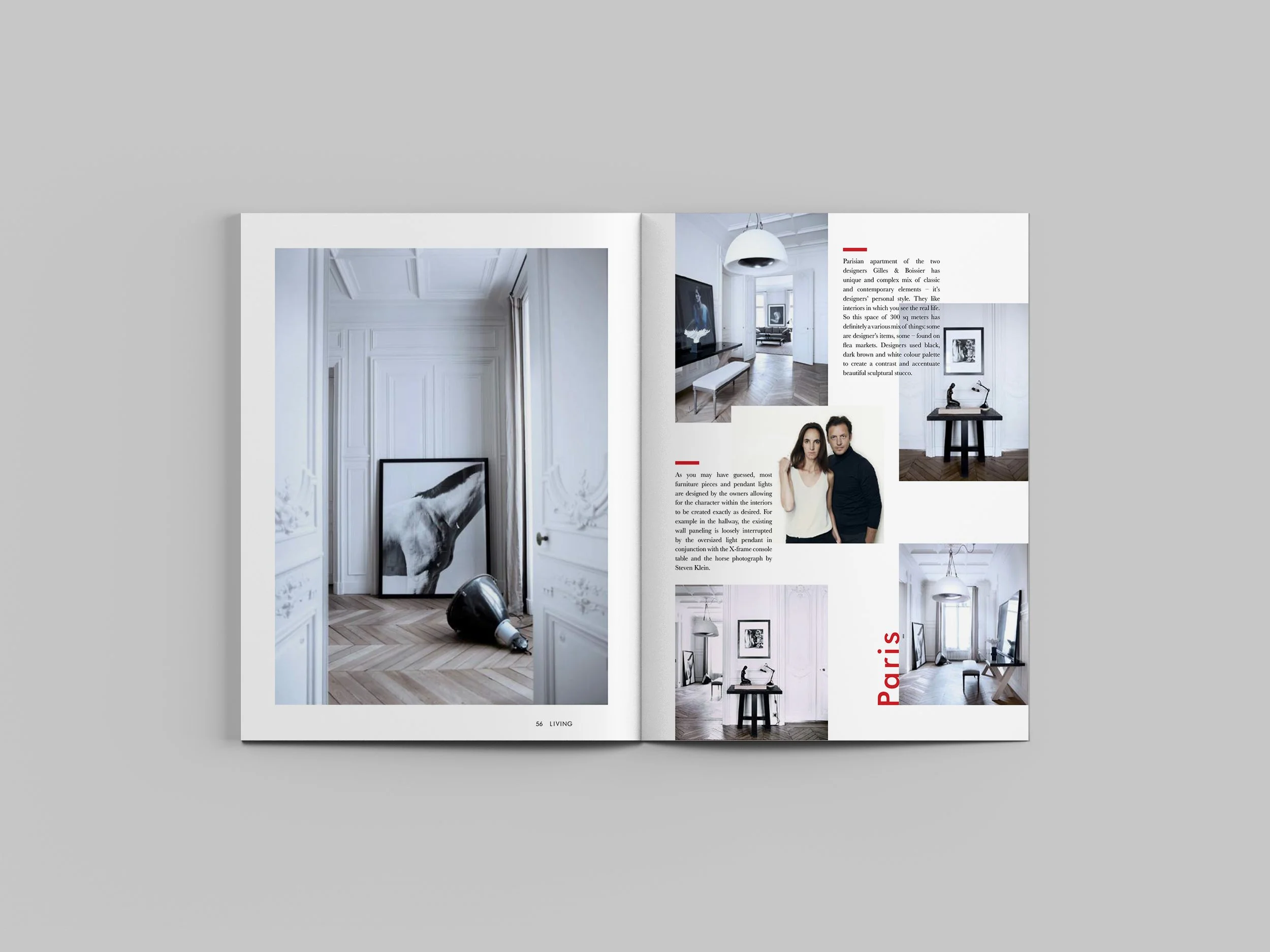 Open magazine showing interior design of a Paris apartment with white walls, art pieces, and modern furniture.