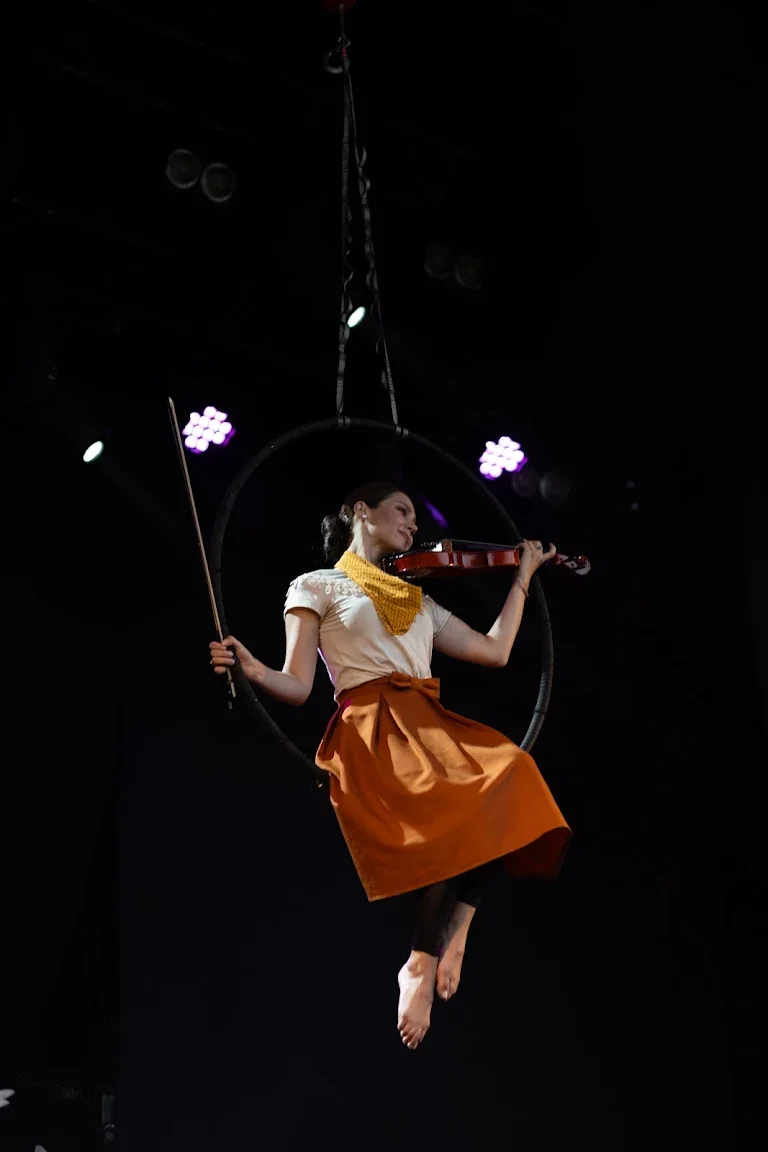 Aerial violinist performing