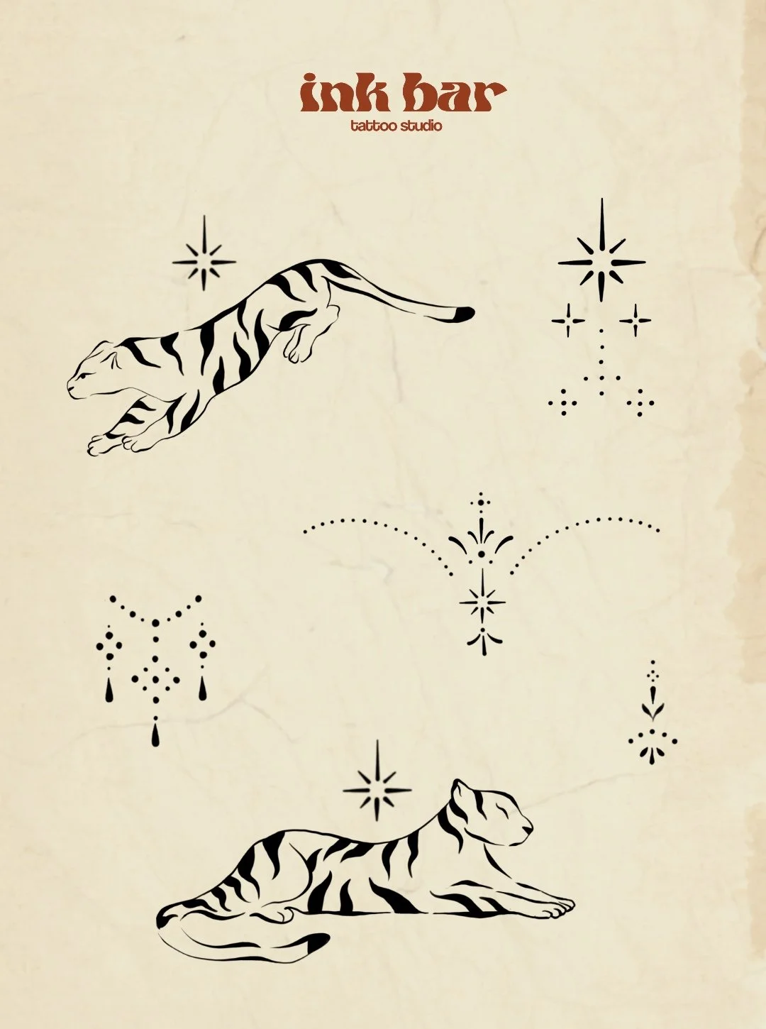 A tattoo design featuring two reclining tigers, one at the top and one at the bottom, with decorative star and dot patterns around them. The text 'ink bar' and 'tattoo studio' are at the top.