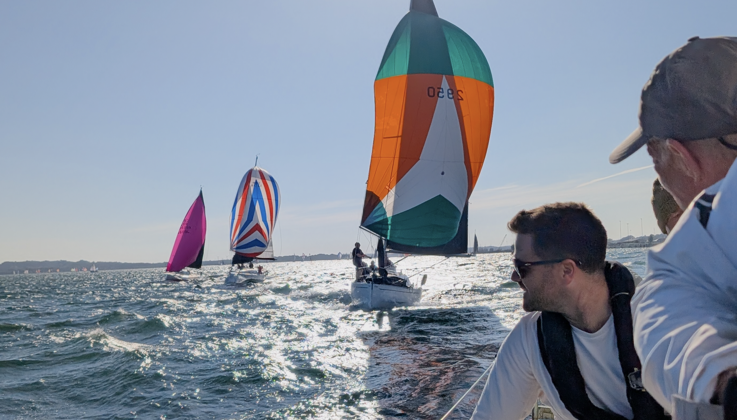 several yachts with colourful spinnakers