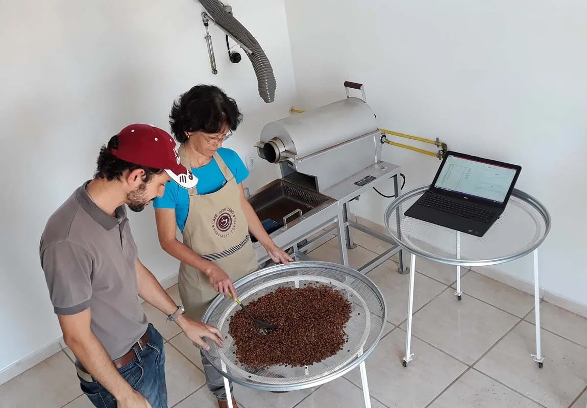Silvia Kurebayashi (right) grows certified organic coffee on two hectares of land. Here, they work with Jonas (left) to develop a roast profile that best suits her coffee.
