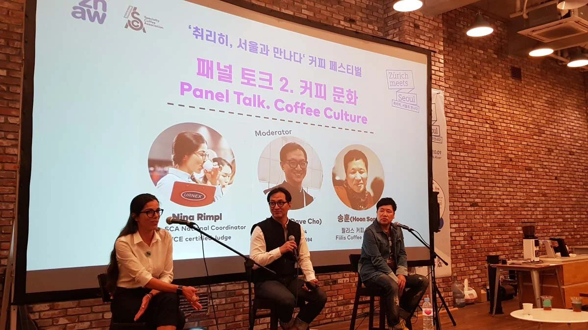 Nina Rimpl, Dave Choi, and Hoon Song present a panel discussion at the Zürich Meets Seoul Coffee Festival.