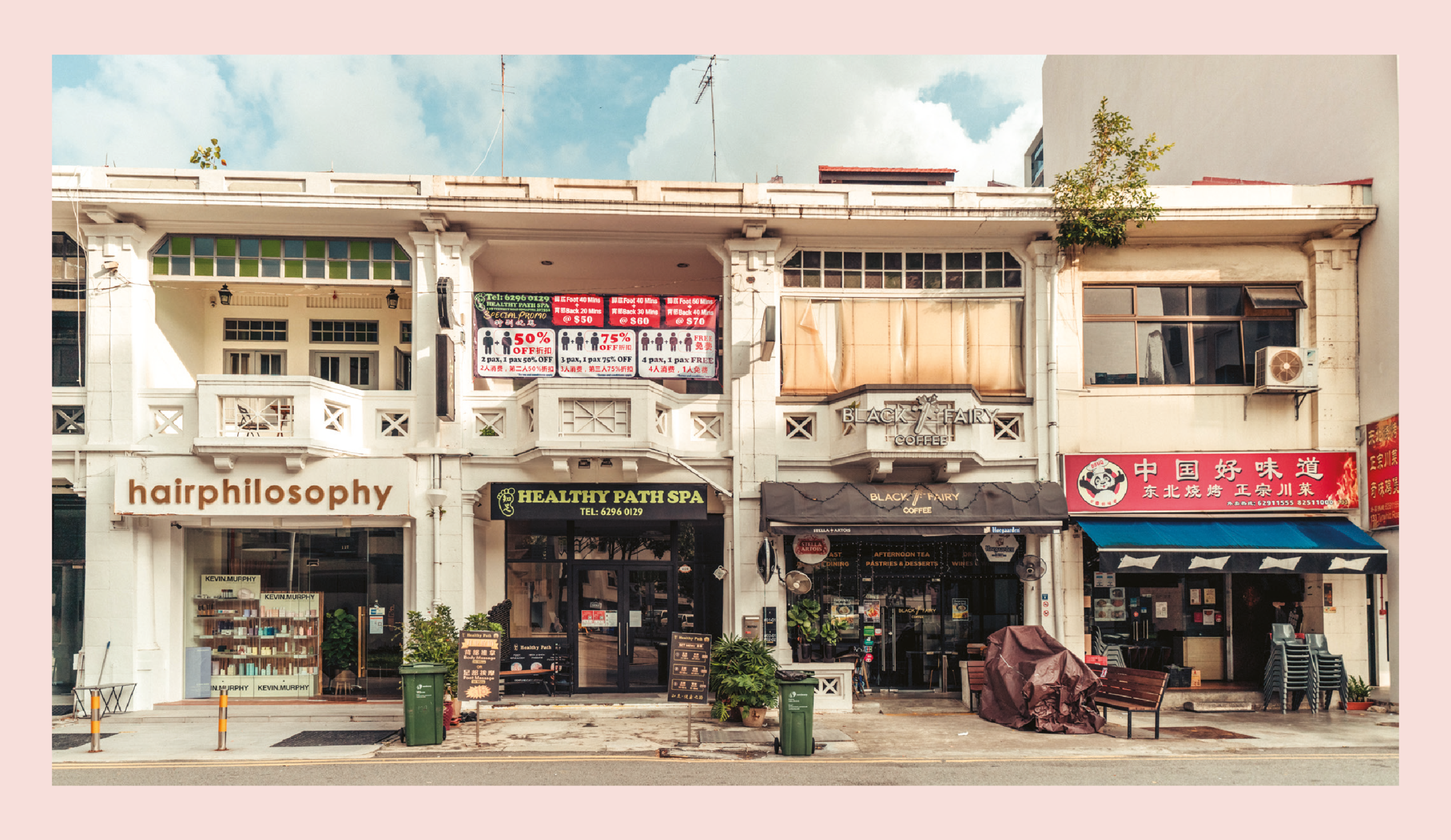 Black Fairy Coffee "stands out" from its neighbors, with relatively understated signage compared to those belonging to a Chinese food stall, a spa, and a salon.