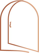 Open wooden door with a rounded top, showing part of the door frame and a door handle.