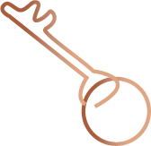 A brown key attached to a round keychain.