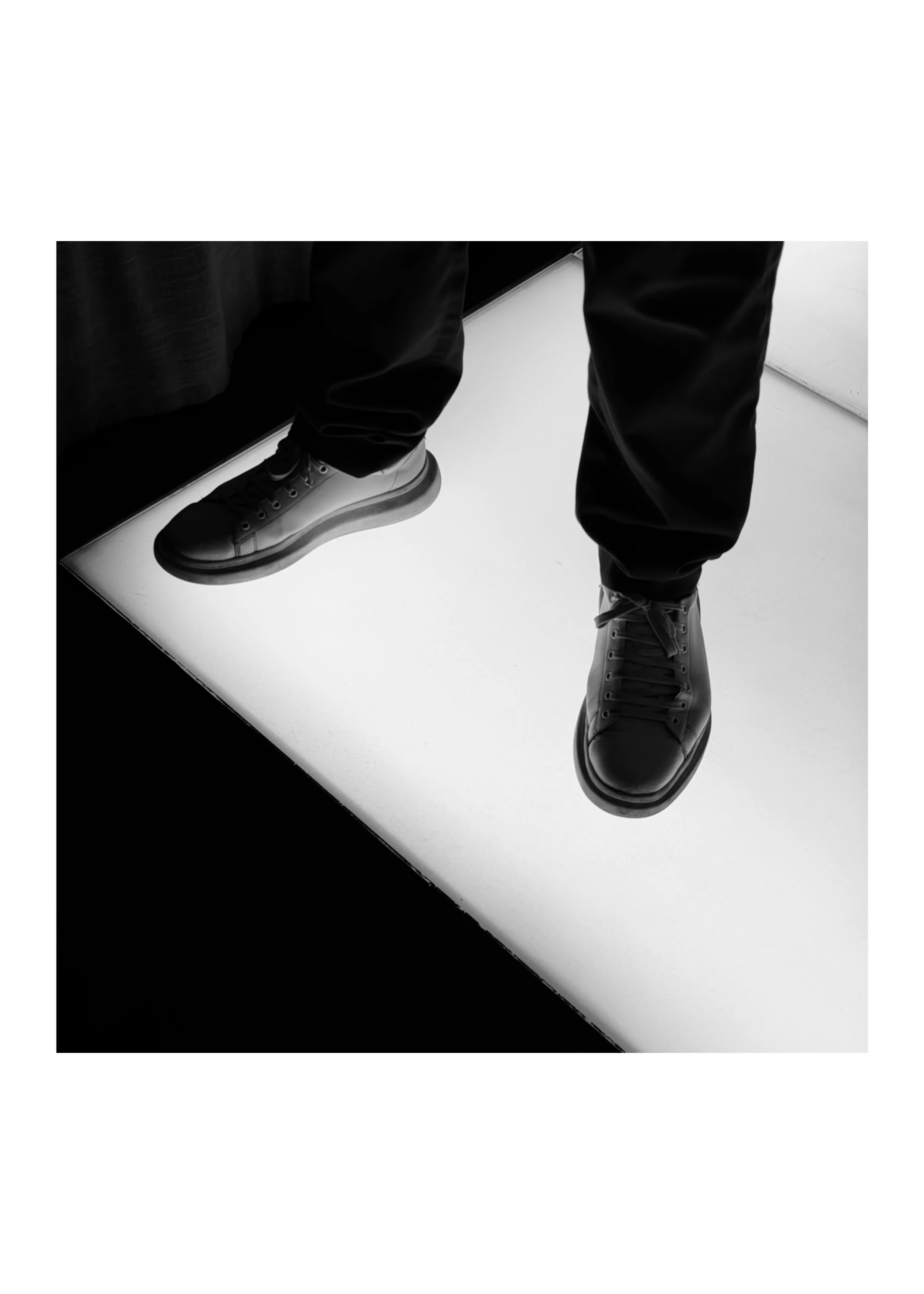 Feet on floor of light