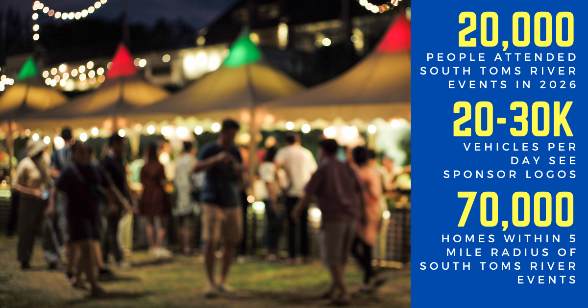 Night scene at South Toms River event with food and craft tents, string lights, and people attending.
