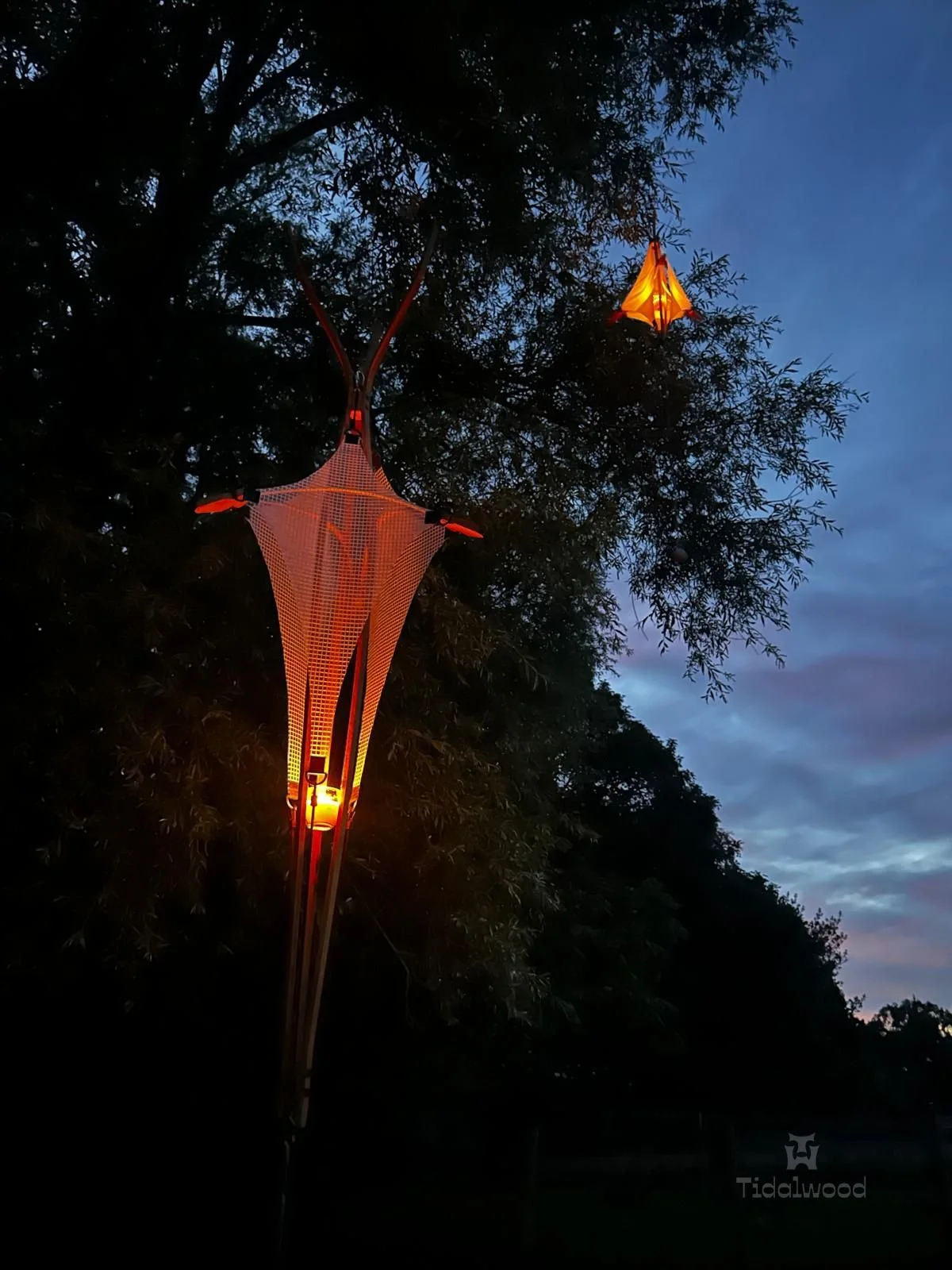 CanopyLamp in tree at dusk with candle
